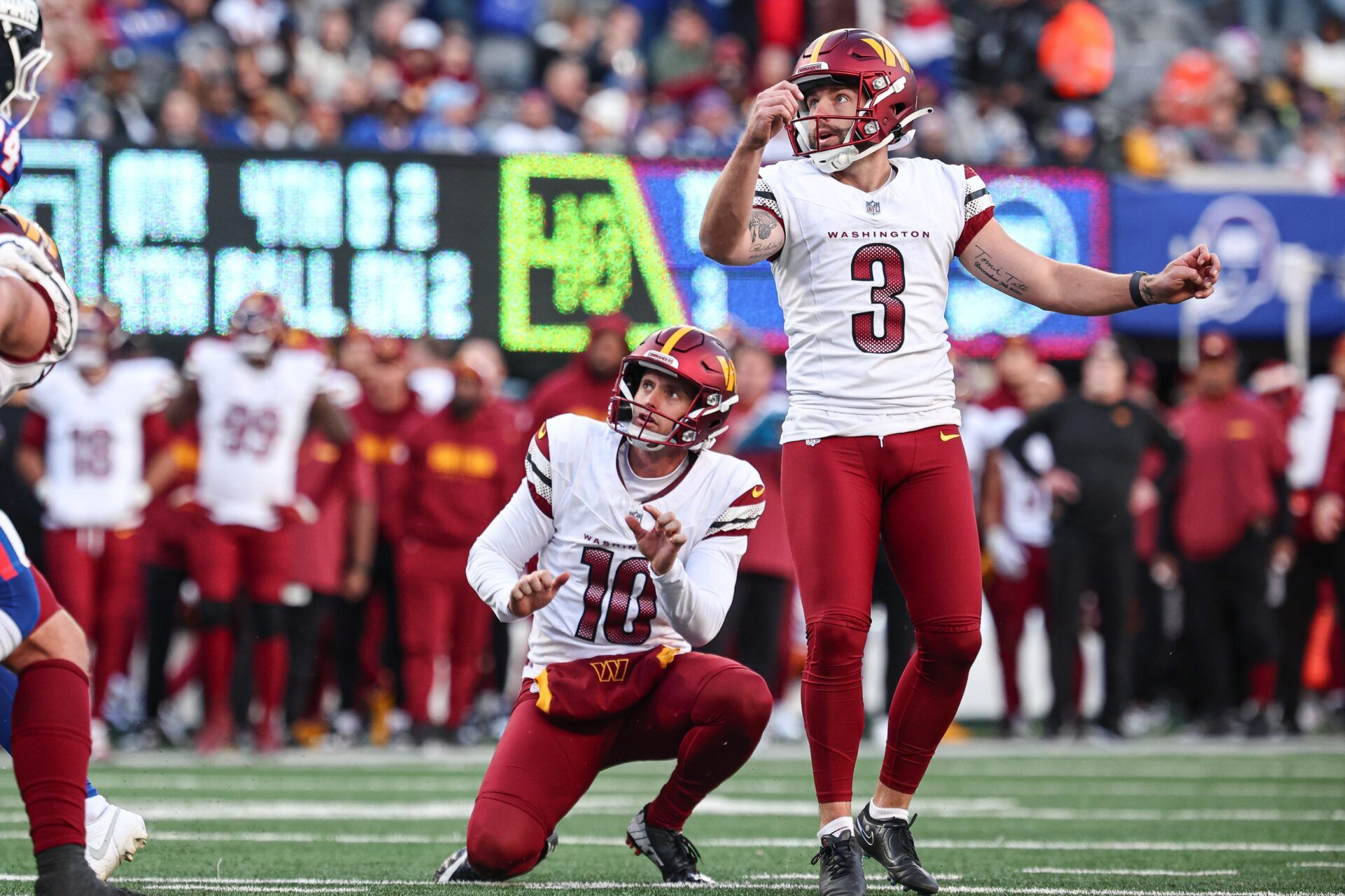 Washington Commanders place kicker Austin Seibert (3) looks up after kicking a field goal during the second half against the New York Giants at MetLife Stadium.