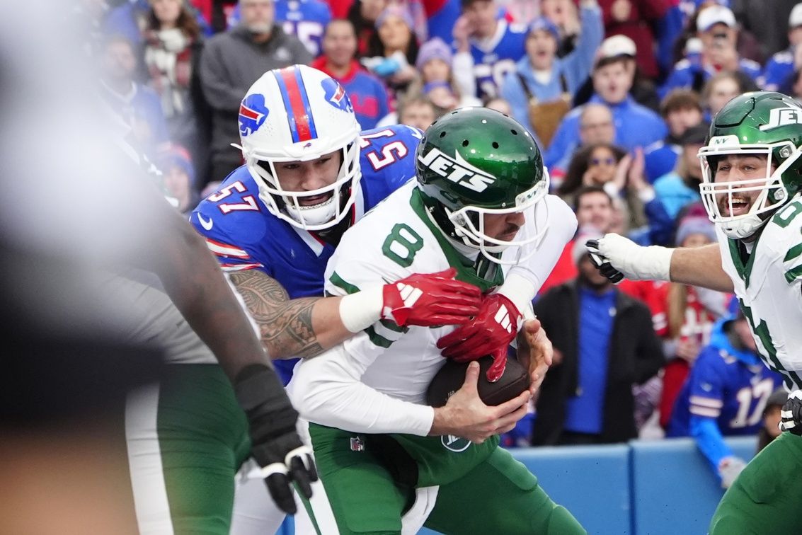 Buffalo Bills defensive end AJ Epenesa (57) sacks New York Jets quarterback Aaron Rodgers (8) for a safety during the first half at Highmark Stadium.