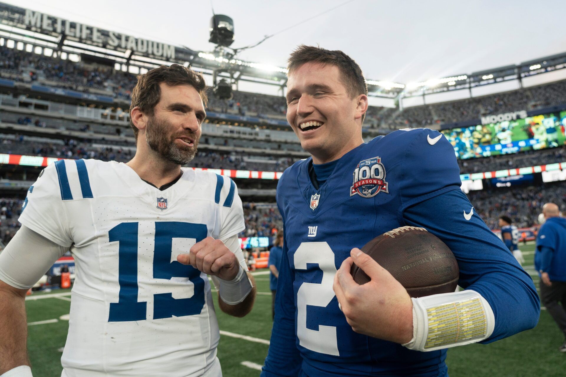 Indianapolis Colts quarterback Joe Flacco (15) and New York Giants quarterback Drew Lock (2) talks after the Giants win between New York Giants and Indianapolis Colts at MetLife Stadium on Sunday, Dec. 29, 2024.