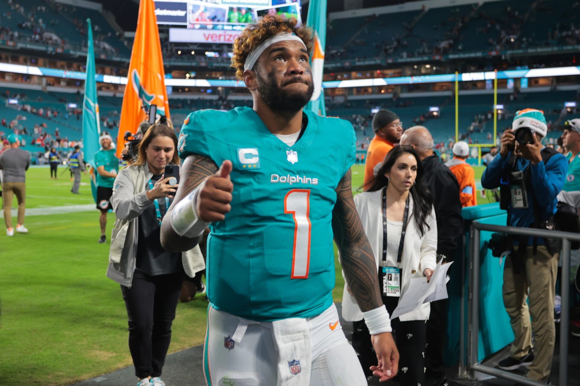 Miami Dolphins quarterback Tua Tagovailoa (1) reacts front field after theme against the San Francisco 49ers at Hard Rock Stadium.