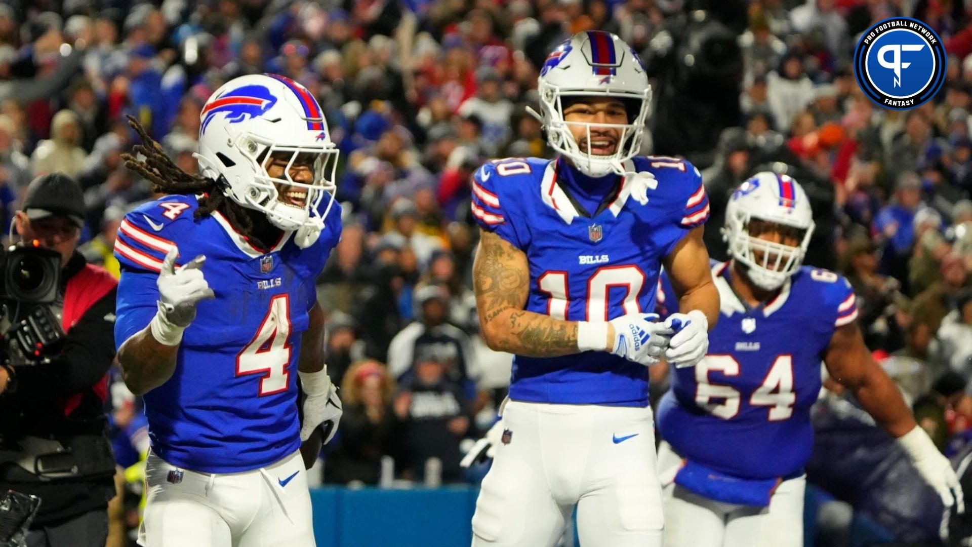 Dec 17, 2023; Orchard Park, New York, USA; Buffalo Bills running back James Cook (4) celebrates a touchdown with Buffalo Bills wide receiver Khalil Shakir (10) in the first half against the Dallas Cowboys at Highmark Stadium. Mandatory Credit: Gregory Fisher-USA TODAY Sports