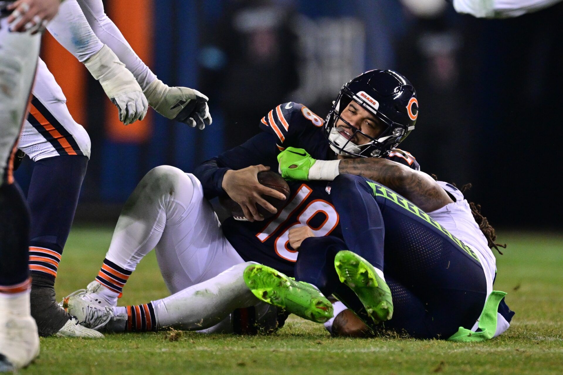 Chicago Bears quarterback Caleb Williams (18) is sacked by Seattle Seahawks defensive back Rayshawn Jenkins (2) during the fourth quarter at Soldier Field. Mandatory