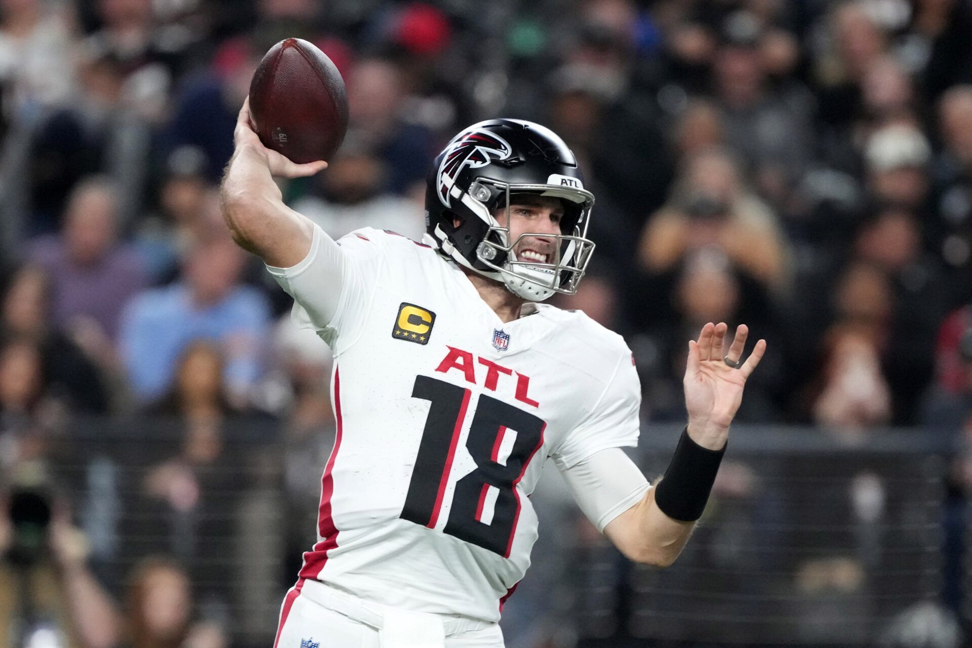 Atlanta Falcons quarterback Kirk Cousins (18) throws the ball against the Las Vegas Raiders in the first half at Allegiant Stadium.