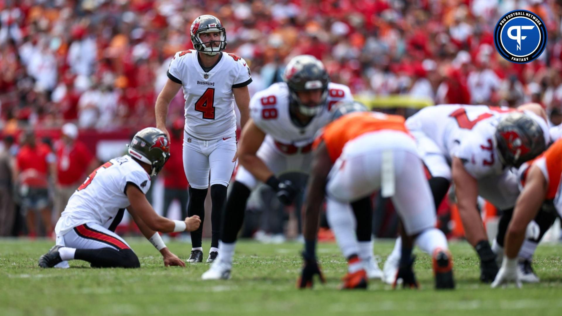 Tampa Bay Buccaneers place kicker Chase McLaughlin (4) looks to kick an extra point against the Denver Broncos in the second quarter at Raymond James Stadium.