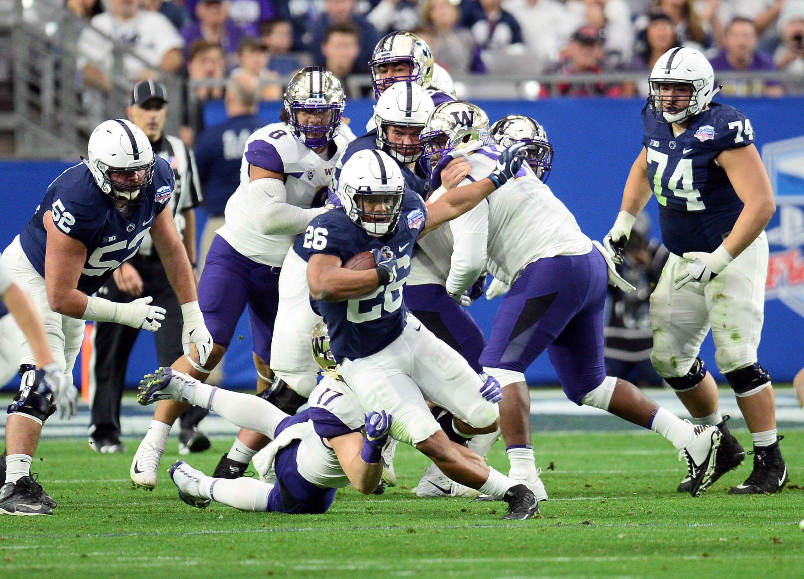 Penn State Nittany Lions running back Saquon Barkley (26) runs against the Washington Huskies during the first half in the 2017 Fiesta Bowl at University of Phoenix Stadium