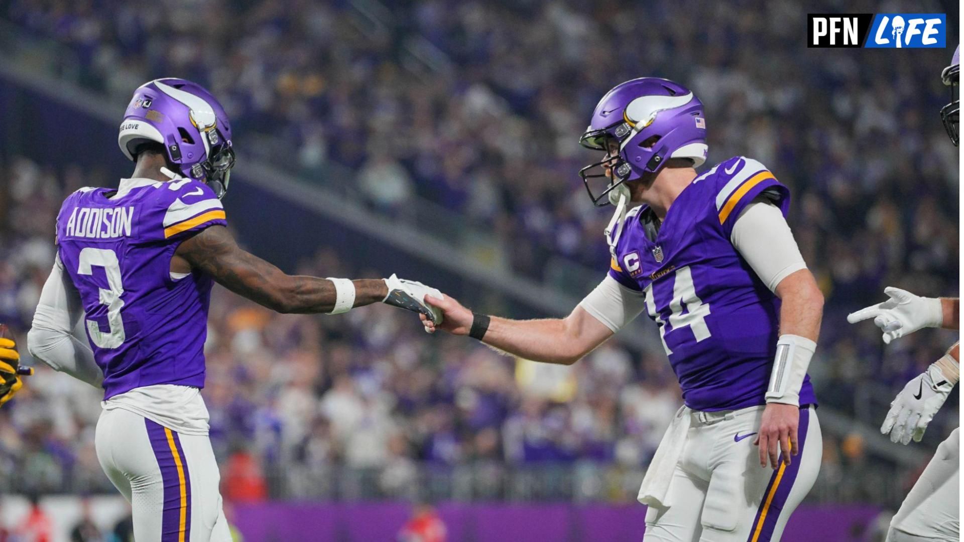 Minnesota Vikings wide receiver Jordan Addison (3) celebrates his touchdown with quarterback Sam Darnold (14) against Green Bay Packers in the third quarter at U.S. Bank Stadium.