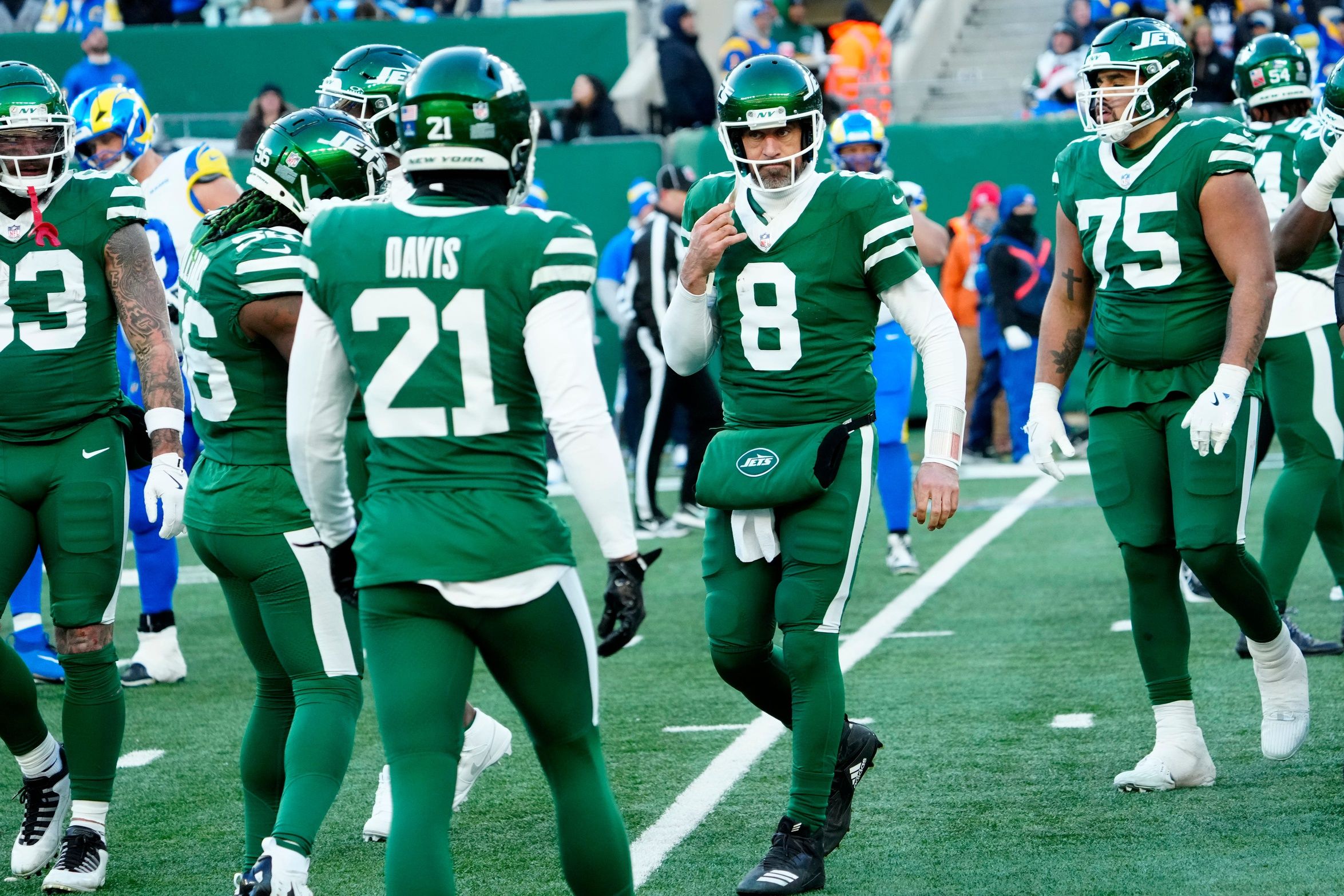 New York Jets quarterback Aaron Rodgers (8) limps off the field during a play where it appeared he had gotten injured, Sunday, December 22, 2024, in East Rutherford. Rodgers was back on the field during Gang GreenÕs next possession.