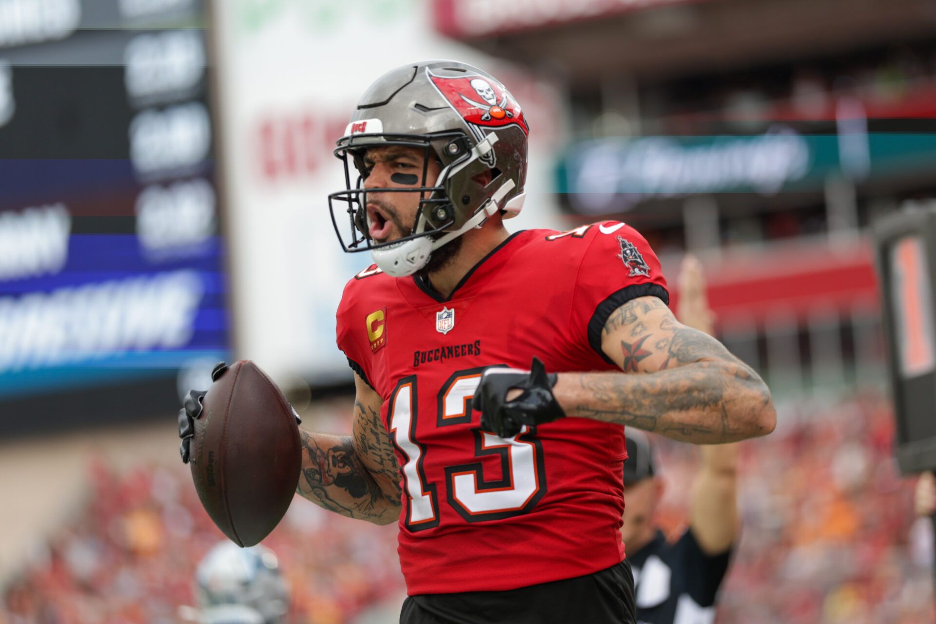 Dec 29, 2024; Tampa, Florida, USA; Tampa Bay Buccaneers wide receiver Mike Evans (13) celebrates after catching a pass for a two point conversion against the Carolina Panthers in the second quarter at Raymond James Stadium. Mandatory Credit: Nathan Ray Seebeck-Imagn Images