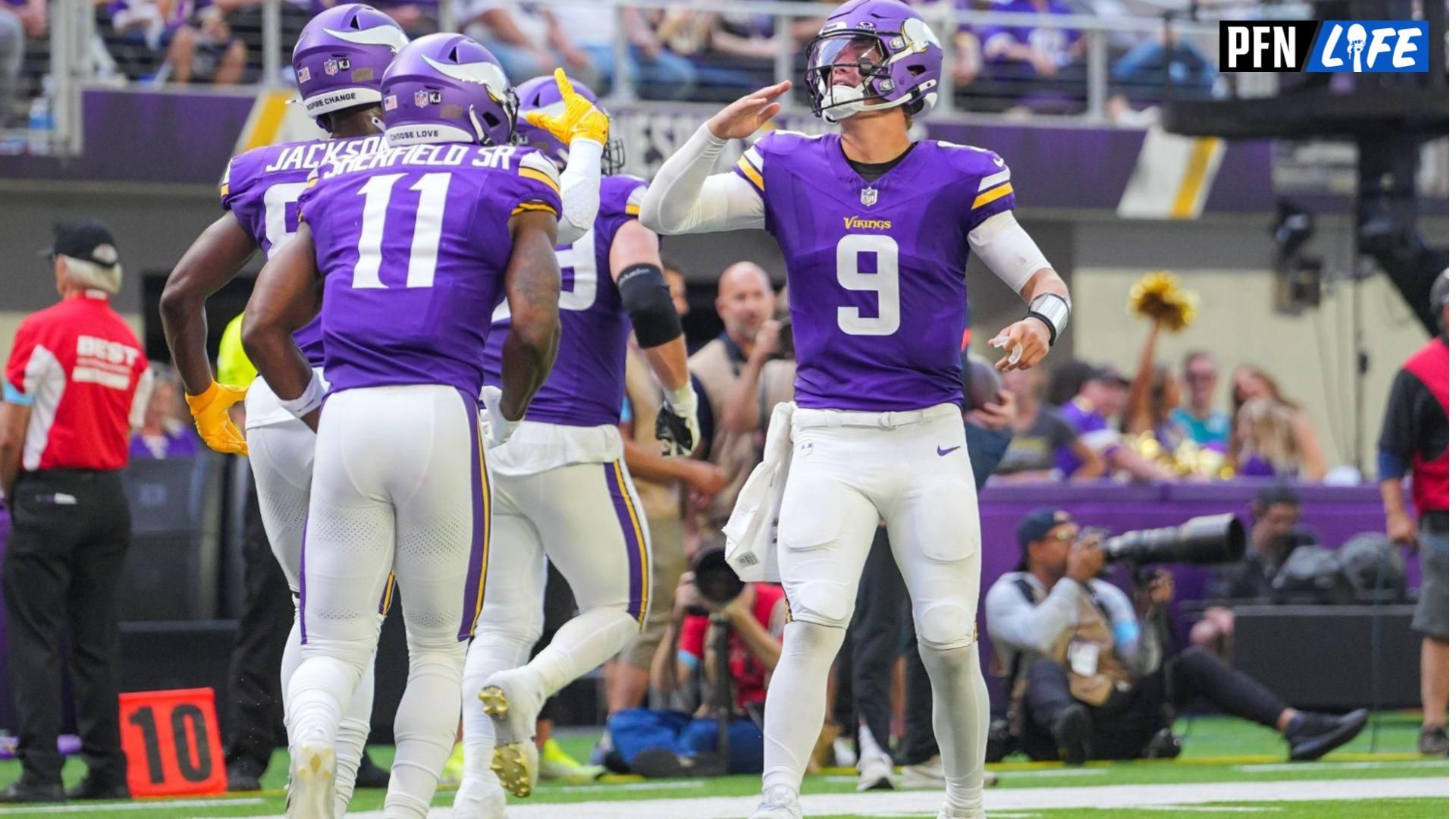 Minnesota Vikings quarterback J.J. McCarthy (9) celebrates wide receiver Trent Sherfield Sr. (11) touchdown against the Las Vegas Raiders in the third quarter at U.S. Bank Stadium.