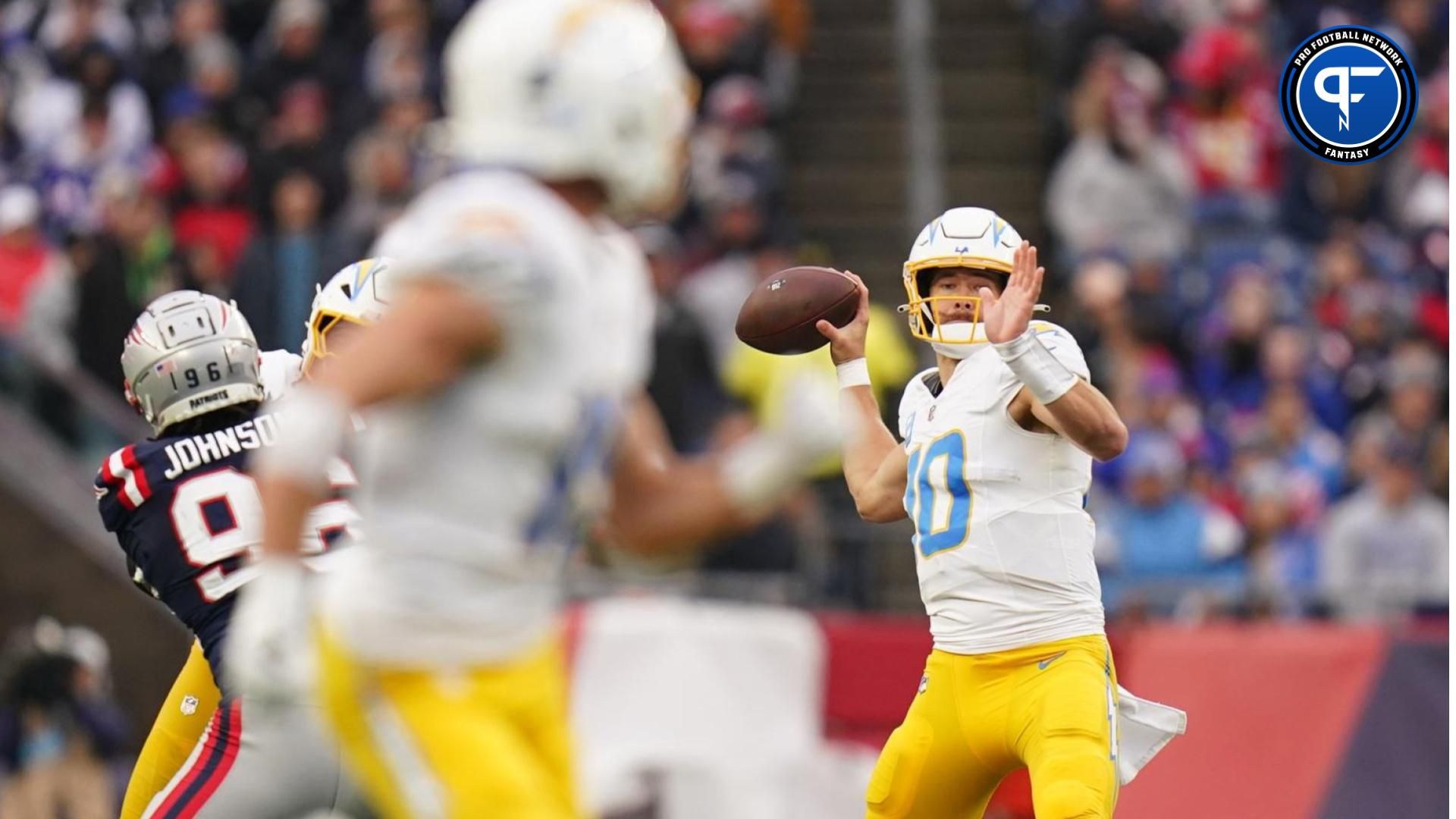 Los Angeles Chargers quarterback Justin Herbert (10) throws a touchdown pass to wide receiver Ladd McConkey (15) against the New England Patriots in the third quarter at Gillette Stadium.