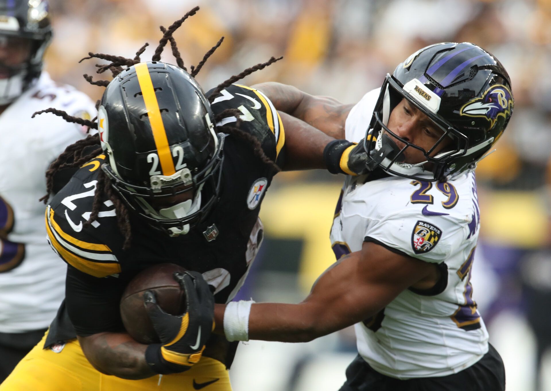 Nov 17, 2024; Pittsburgh, Pennsylvania, USA; Pittsburgh Steelers running back Najee Harris (22) carries the ball against Baltimore Ravens safety Ar'Darius Washington (29) during the fourth quarter at Acrisure Stadium. Mandatory Credit: Charles LeClaire-Imagn Images