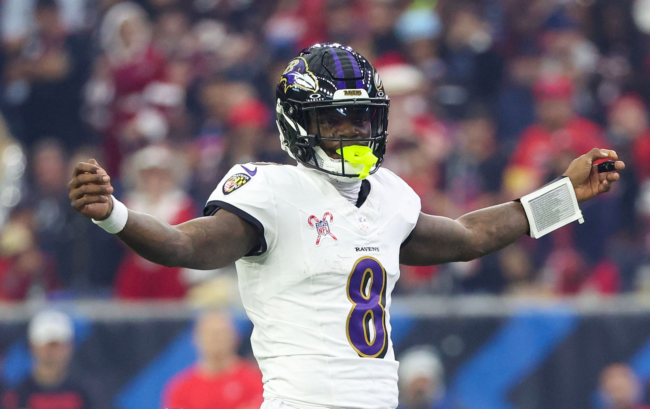 Dec 25, 2024; Houston, Texas, USA; Baltimore Ravens quarterback Lamar Jackson (8) reacts under center against the Houston Texans in the first quarter at NRG Stadium. Mandatory Credit: Thomas Shea-Imagn Images