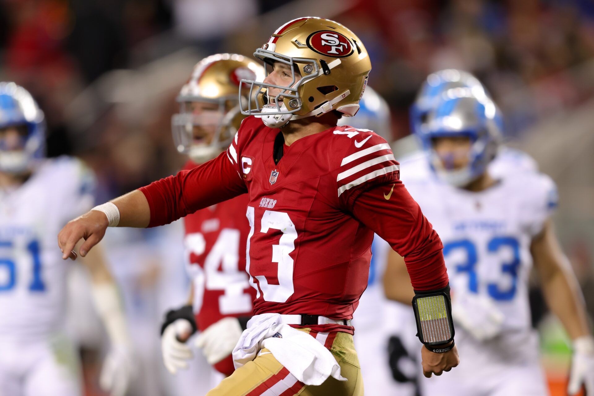 San Francisco 49ers quarterback Brock Purdy (13) celebrates after scoring a touchdown during the second quarter against the Detroit Lions at Levi's Stadium.