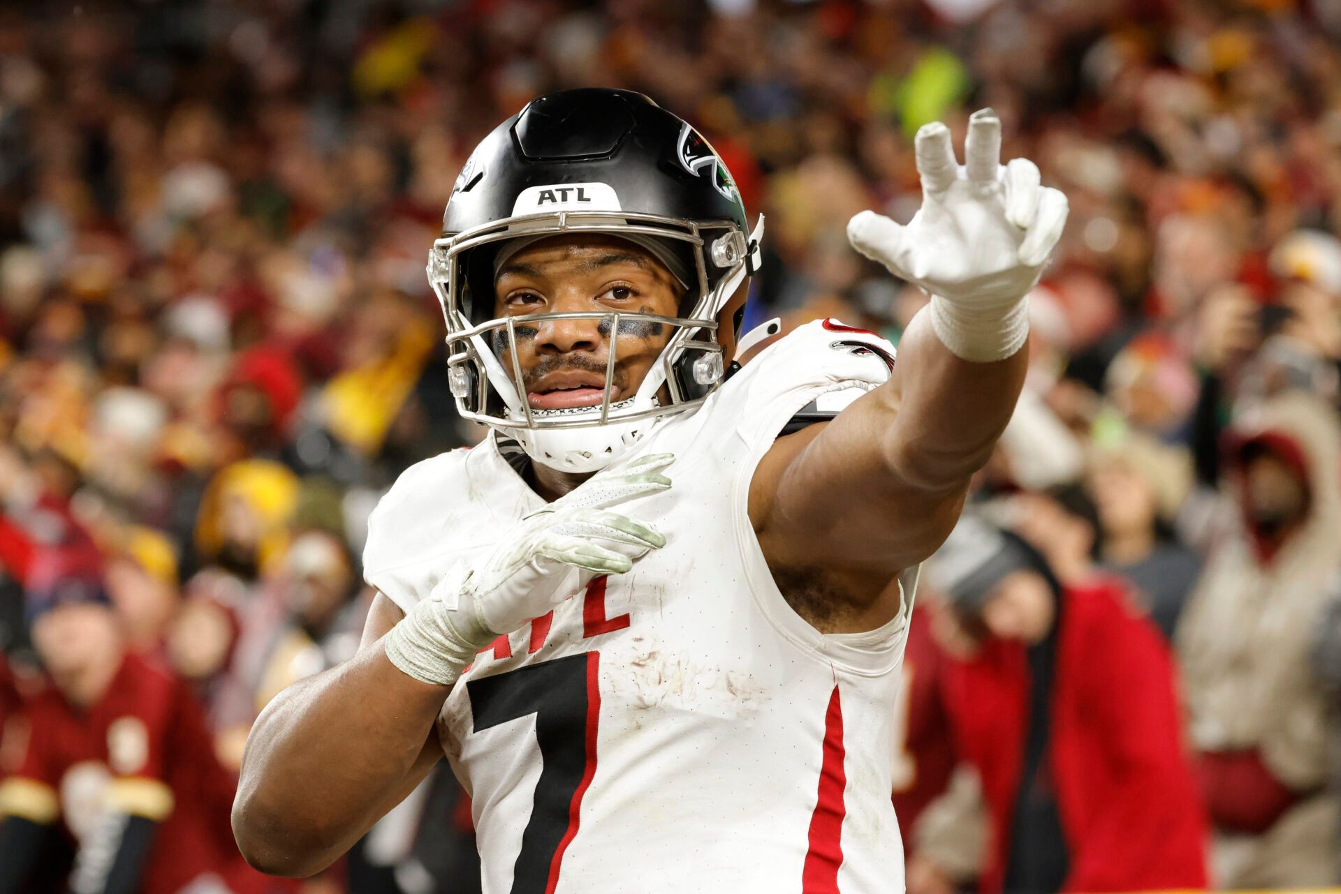 Dec 29, 2024; Landover, Maryland, USA; Atlanta Falcons running back Bijan Robinson (7) celebrates after scoring a touchdown against the Washington Commanders during the first half at Northwest Stadium. Mandatory Credit: Amber Searls-Imagn Images