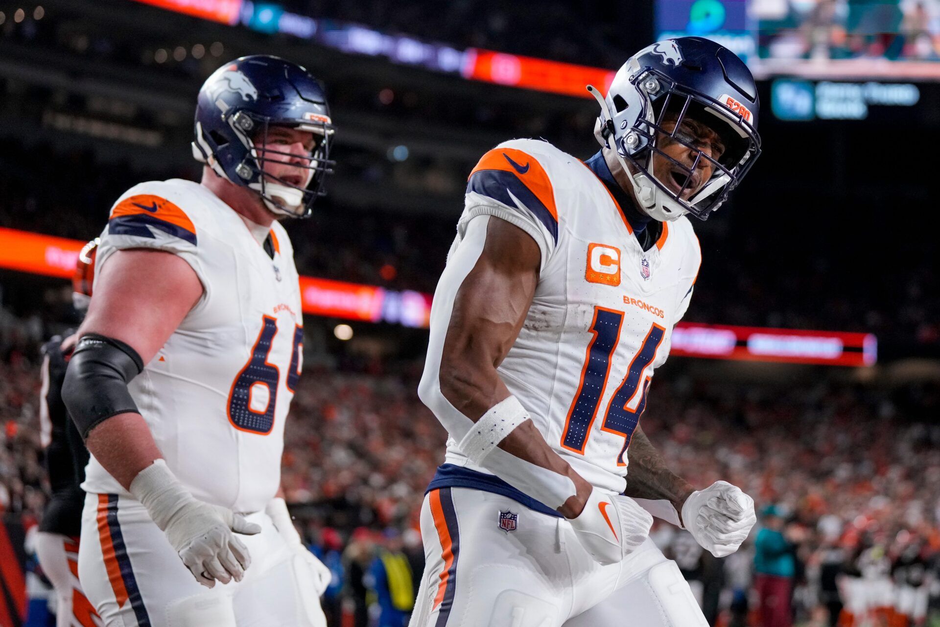 Denver Broncos wide receiver Courtland Sutton (14) celebrates a touchdown catch in the third quarter of the NFL Week 17 game between the Cincinnati Bengals and the Denver Broncos at Paycor Stadium in downtown Cincinnati on Saturday, Dec. 28, 2024. The Bengals took a 30-24 win in overtime to remain in the post season chase.