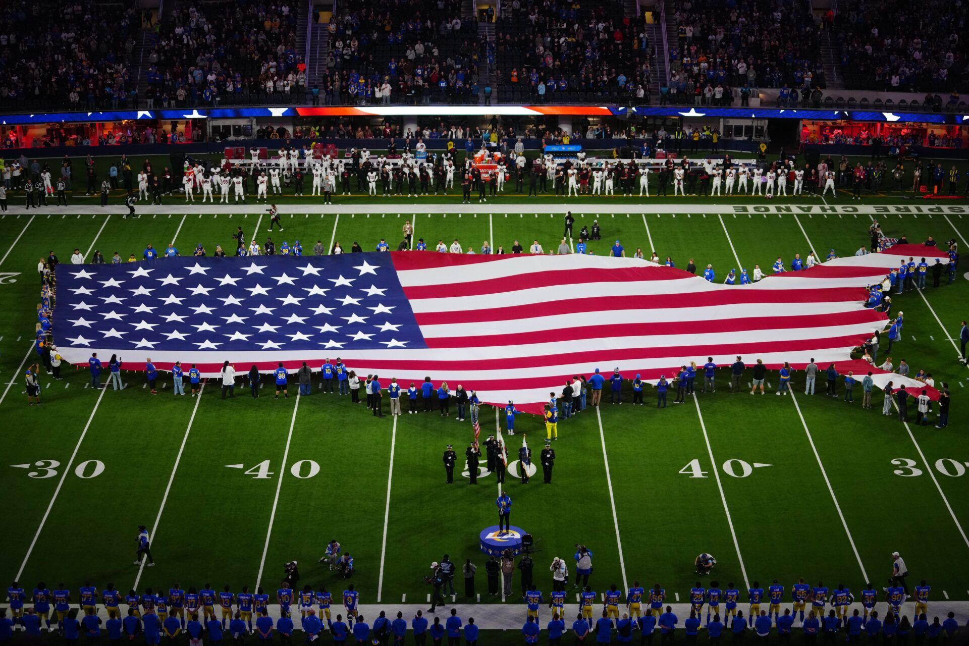 A general overall view of a United States flag on the field as saxophonist Michael Phillips performs the national anthem before the game between the Arizona Cardinals and the Los Angeles Rams at SoFi Stadium.