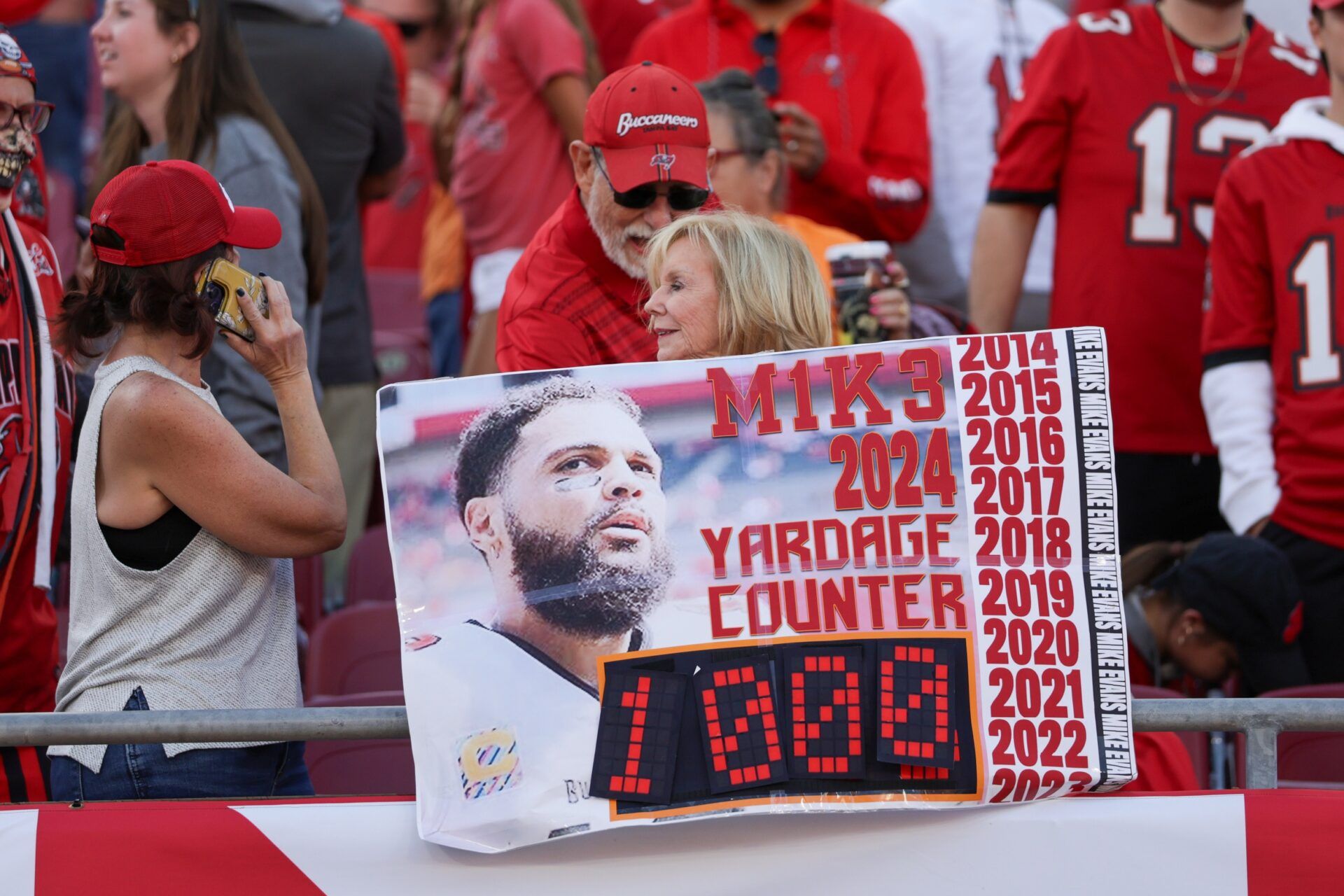 fans celebrate Tampa Bay Buccaneers wide receiver Mike Evans (13) (not pictured) record pass against the New Orleans Saints in the fourth quarter at Raymond James Stadium.