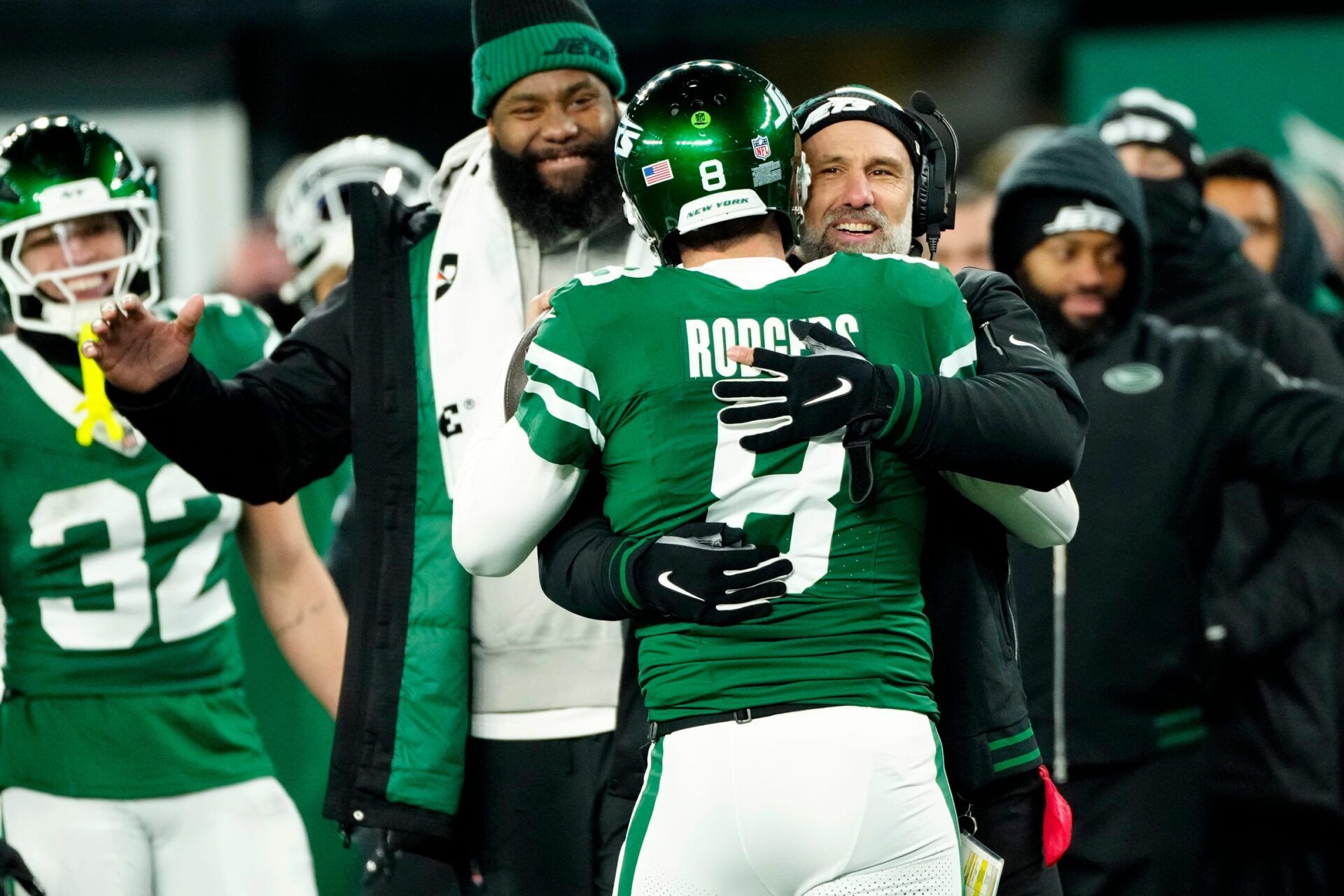 New York Jets Interim Head Coach Jeff Ulbrich congratulates New York Jets quarterback Aaron Rodgers (8) after he completed his 500th career touchdown pass, Sunday January 5, 2025, in East Rutherford.