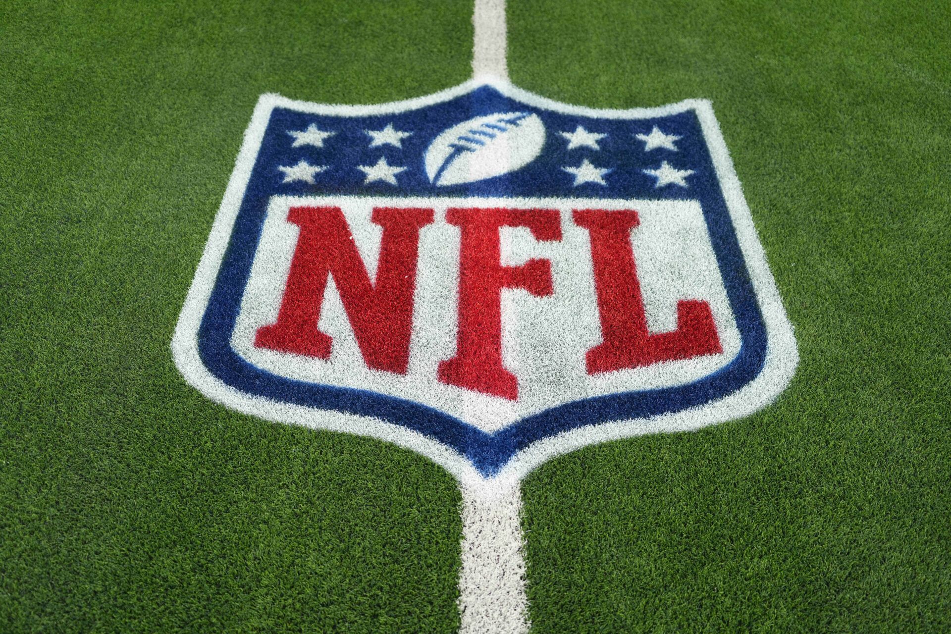 Dec 28, 2024; Inglewood, California, USA; The NFL shield logo is seen on the field at SoFi Stadium before a game between the Arizona Cardinals and Los Angeles Rams. Mandatory Credit: Kirby Lee-Imagn Images