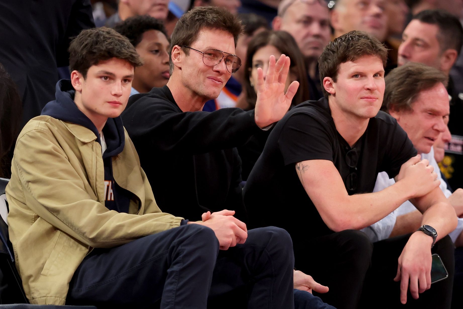 NFL former quarterback Tom Brady sits court side during the third quarter between the New York Knicks and the Brooklyn Nets at Madison Square Garden.