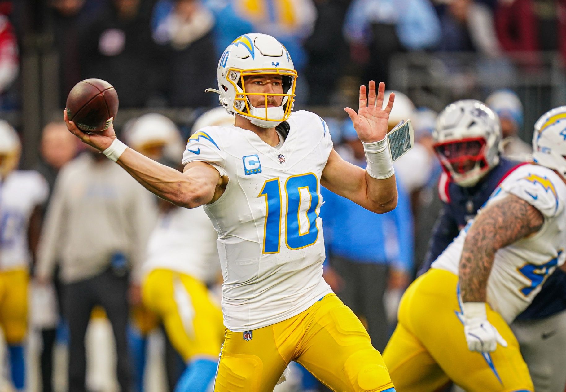 Los Angeles Chargers quarterback Justin Herbert (10) passes the ball against the New England Patriots in the third quarter at Gillette Stadium.