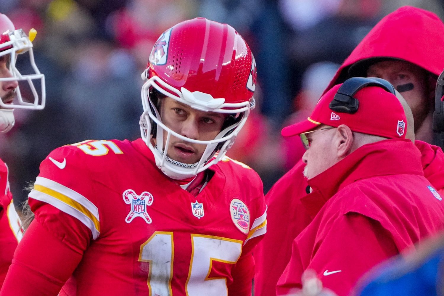 Kansas City Chiefs quarterback Patrick Mahomes (15) talks with head coach Andy Reid during the second half against the Houston Texans at GEHA Field at Arrowhead Stadium.