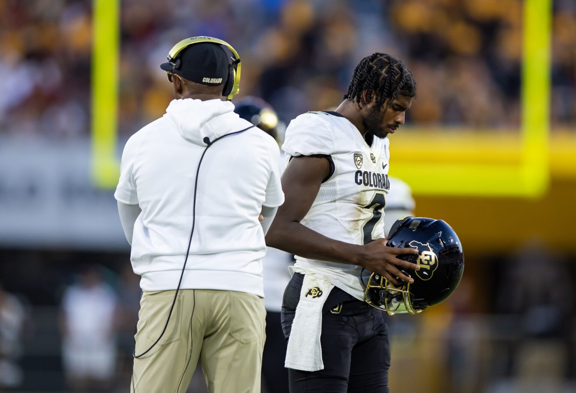 Colorado Buffaloes head coach Deion Sanders with son and quarterback Shedeur Sanders (2) against the Arizona State Sun Devils at Mountain America Stadium