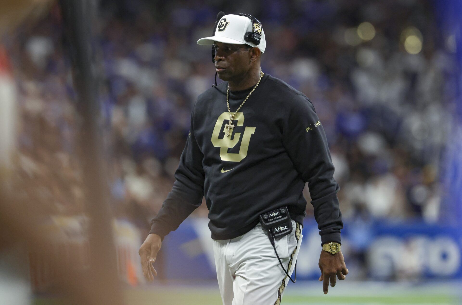 Colorado Buffaloes head coach Deion Sanders walks on the field during the game against the Brigham Young Cougars at Alamodome.