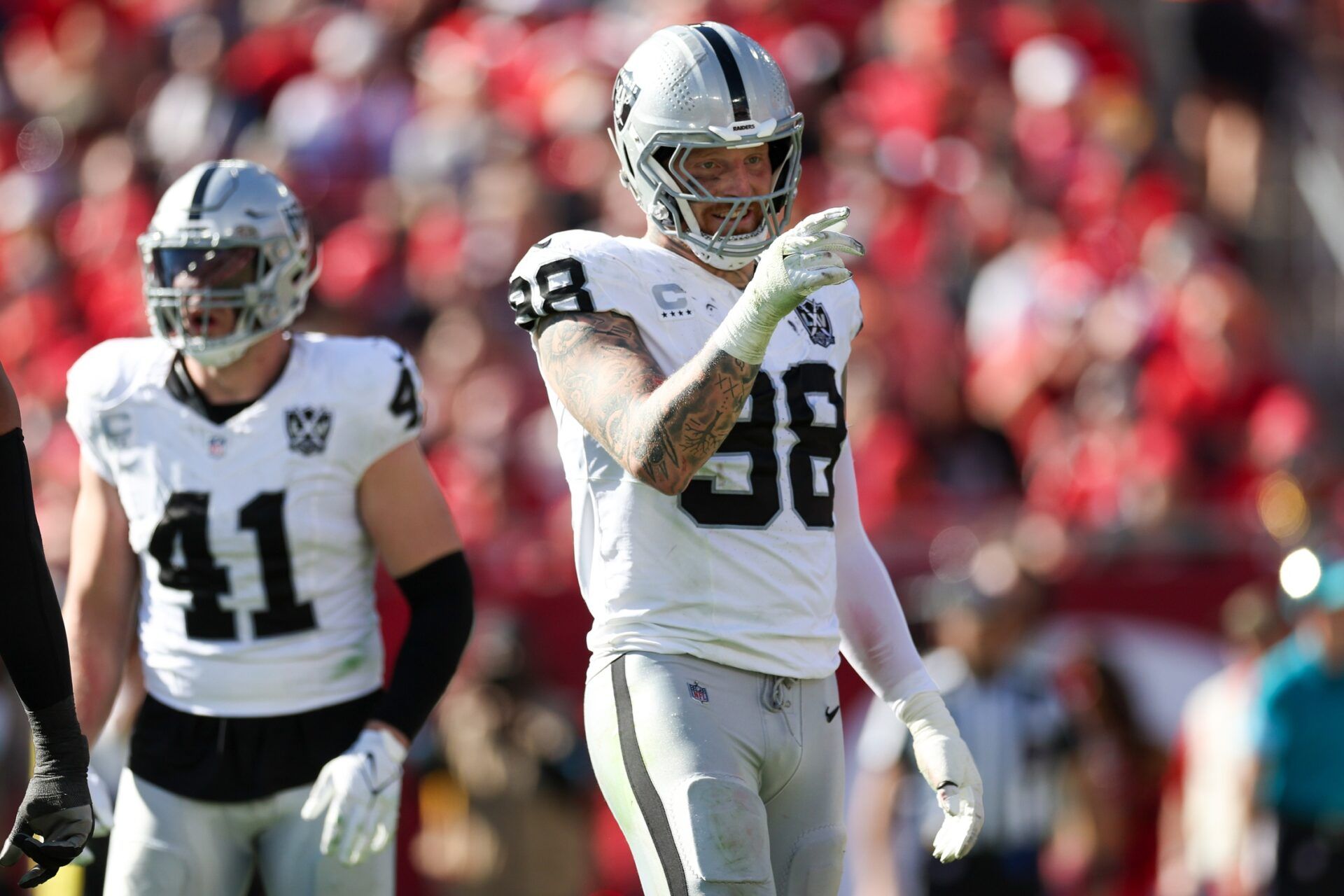 Las Vegas Raiders defensive end Maxx Crosby (98) celebrates after a sack against the Tampa Bay Buccaneers in the second quarter at Raymond James Stadium.