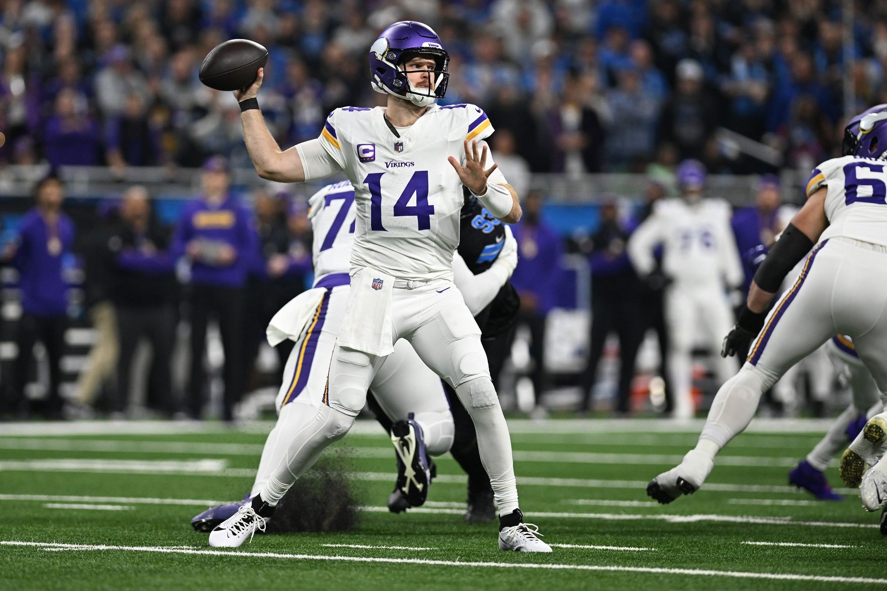 Minnesota Vikings quarterback Sam Darnold (14) throws the ball against the Detroit Lions in the first quarter at Ford Field.