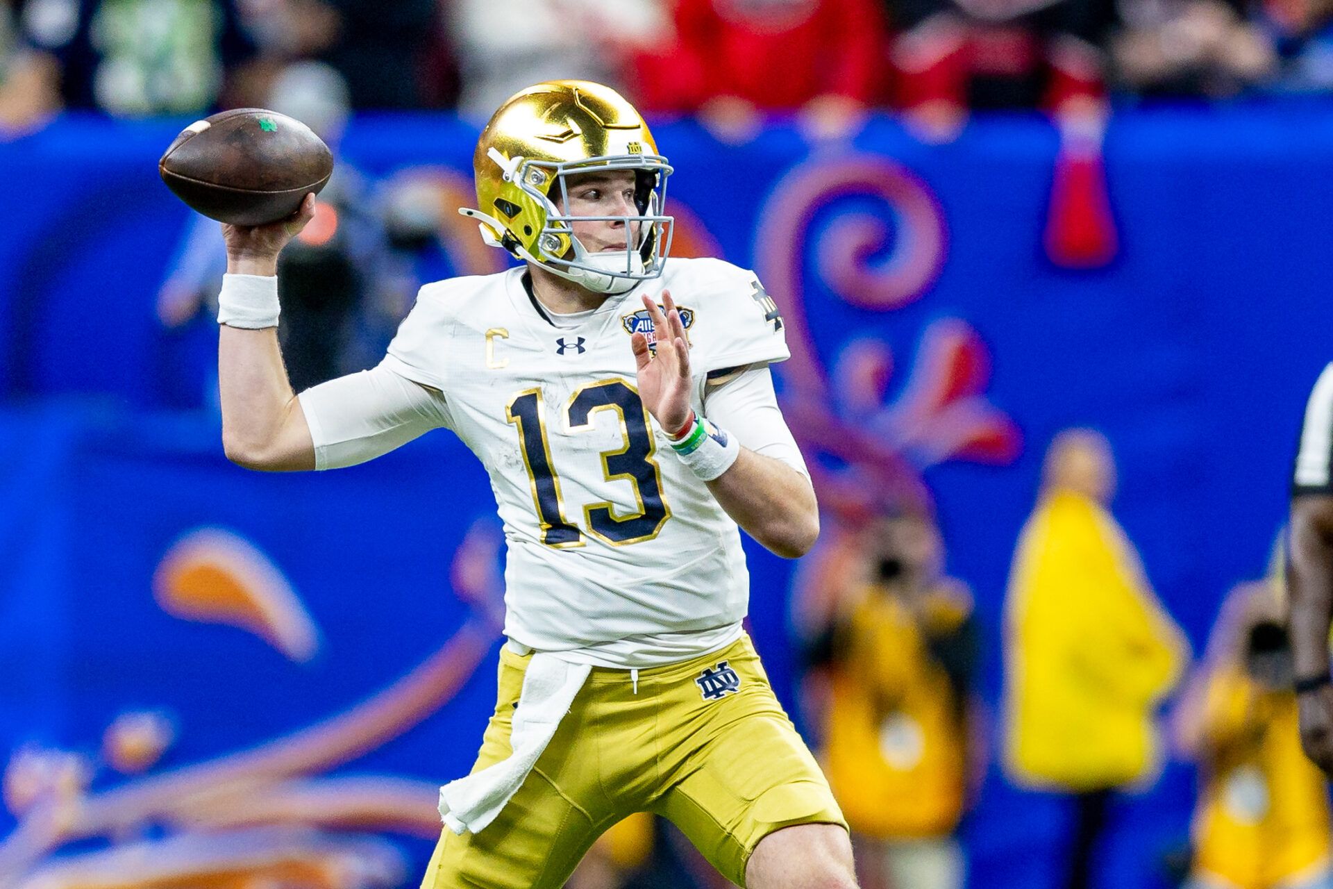 Jan 2, 2025; New Orleans, LA, USA; Notre Dame Fighting Irish quarterback Riley Leonard (13) passes against the Georgia Bulldogs during the second half at Caesars Superdome. Mandatory Credit: Stephen Lew-Imagn Images