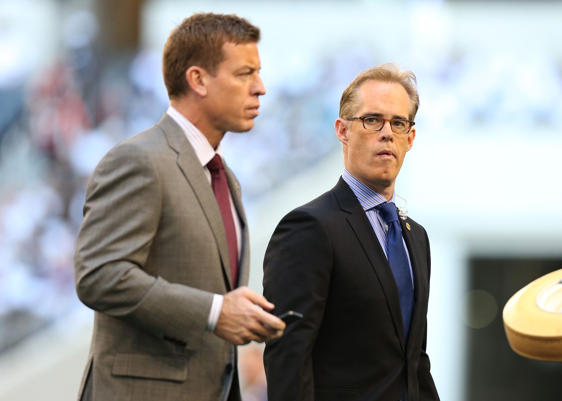 Fox announcers Troy Aikman (left) and Joe Buck on the field prior to the game with the Dallas Cowboys playing against the Washington Redskins on Thanksgiving at Cowboys Stadium.