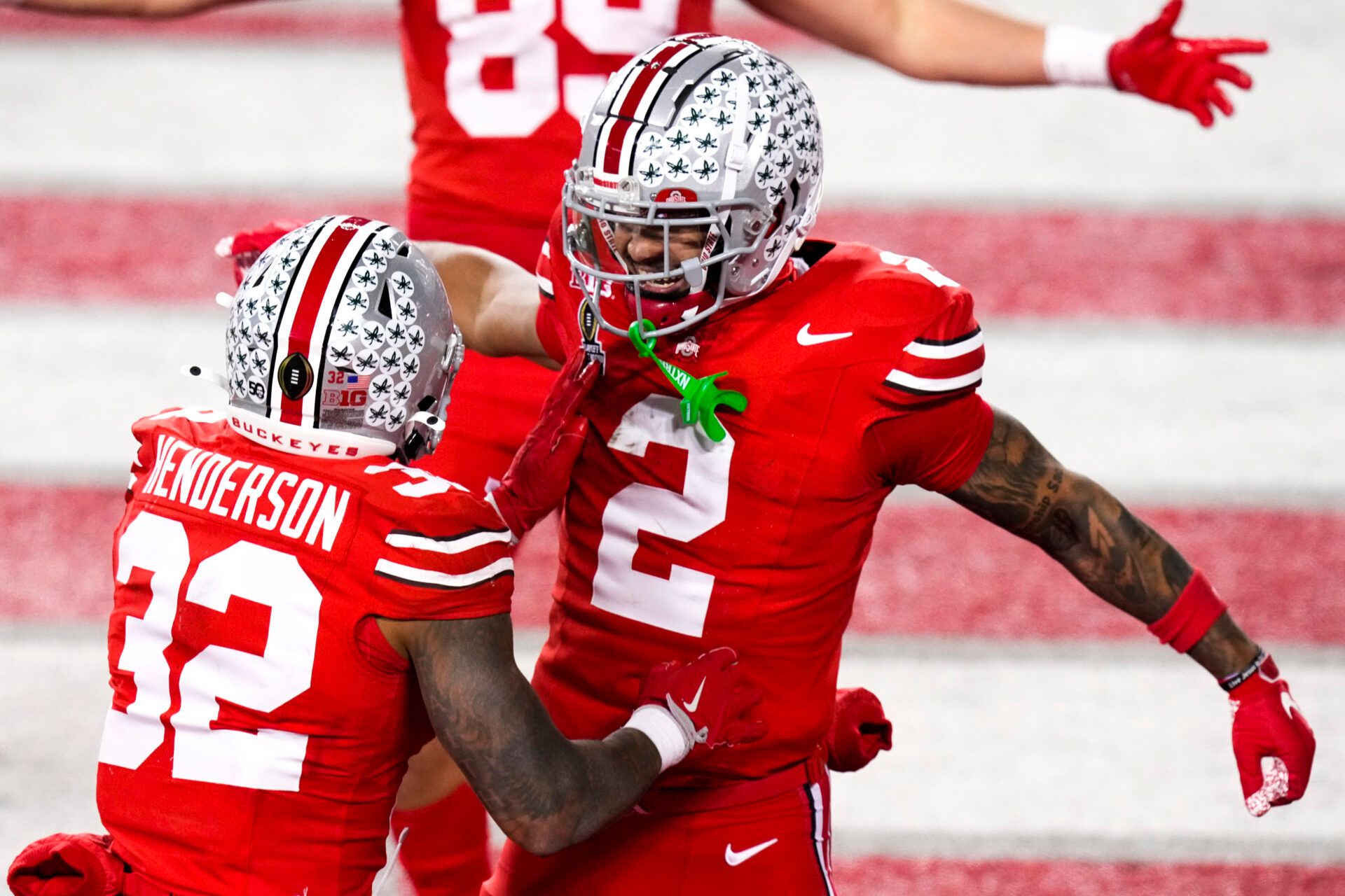 Dec 21, 2024; Columbus, Ohio, USA; Ohio State Buckeyes running back TreVeyon Henderson (32) celebrates with wide receiver Emeka Egbuka (2) after scoring a touchdown against the Tennessee Volunteers in the second half at Ohio Stadium. Mandatory Credit: Samantha Madar/USA Today Network via Imagn Images