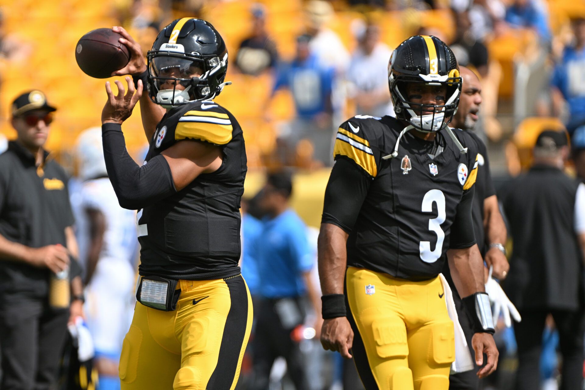 Sep 22, 2024; Pittsburgh, Pennsylvania, USA; Pittsburgh Steelers quarterback Justin Fields (2) warms up next to quarterback Russell Wilson (3) before a game against the Los Angeles Chargers at Acrisure Stadium. Mandatory Credit: Barry Reeger-Imagn Images