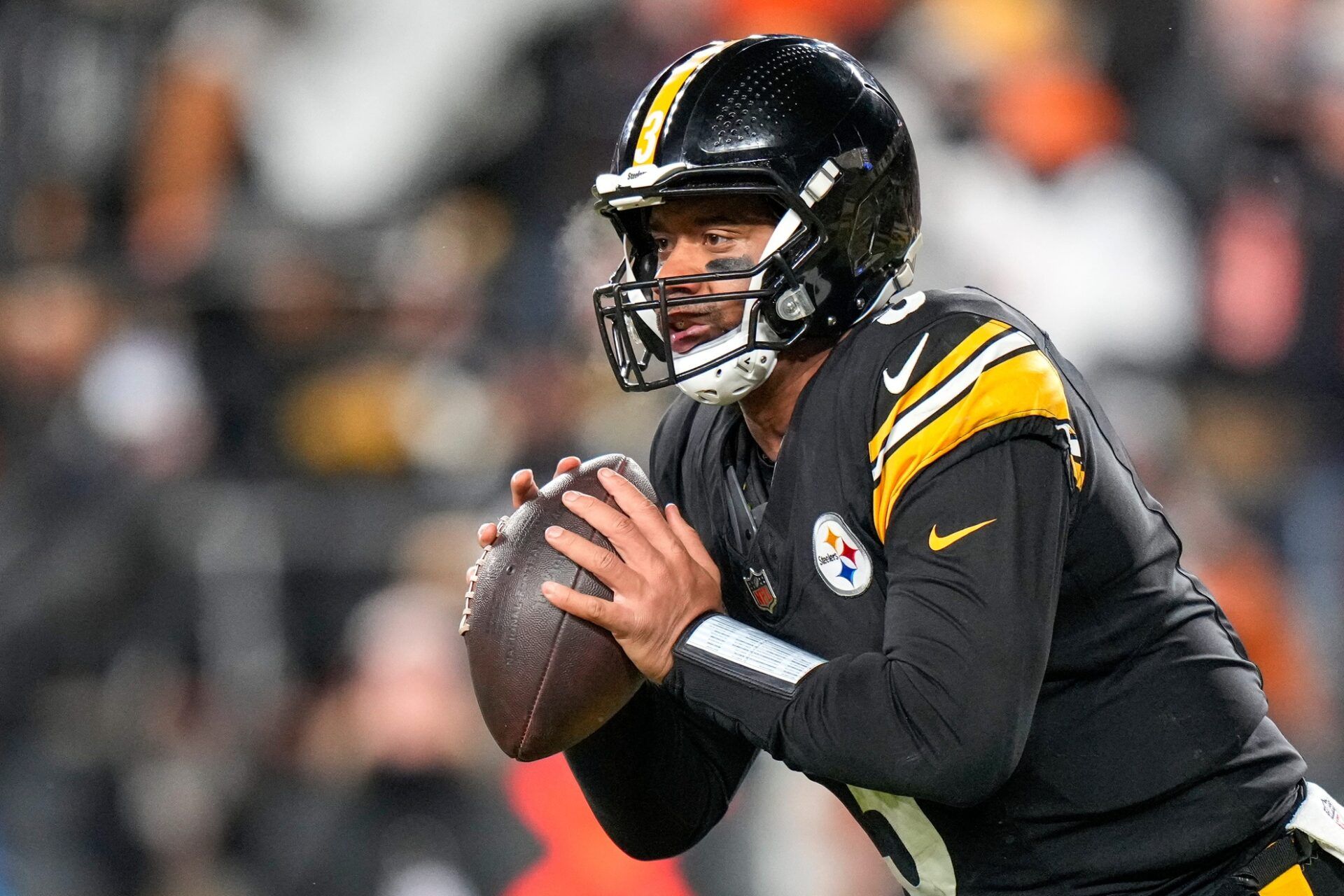 Pittsburgh Steelers quarterback Russell Wilson (3) scrambles out of the pocket in the fourth quarter of the NFL Week 18 game between the Pittsburgh Steelers and the Cincinnati Bengals at Acrisure Stadium in Pittsburgh on Saturday, Jan. 4, 2025. The Bengals won 19-17 to finish the regular season at 9-8.