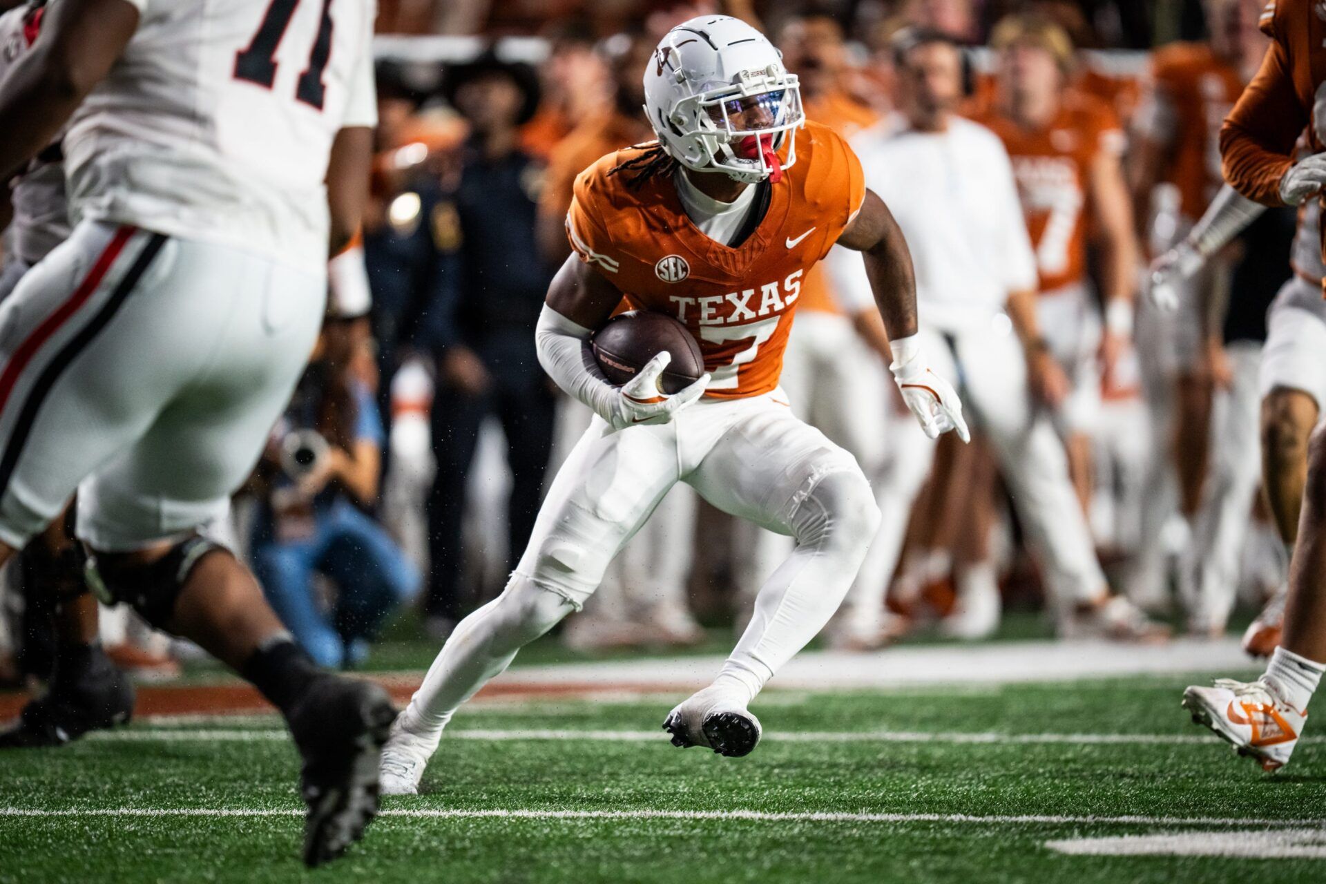 Texas Longhorns wide receiver Isaiah Bond (7) carries the ball down the field after making an interception for Texas in the third quarter of the Longhorns' game against the Georgia Bulldogs at Darrell K. Royal Texas Memorial Stadium in Austin, Oct. 19, 2024.