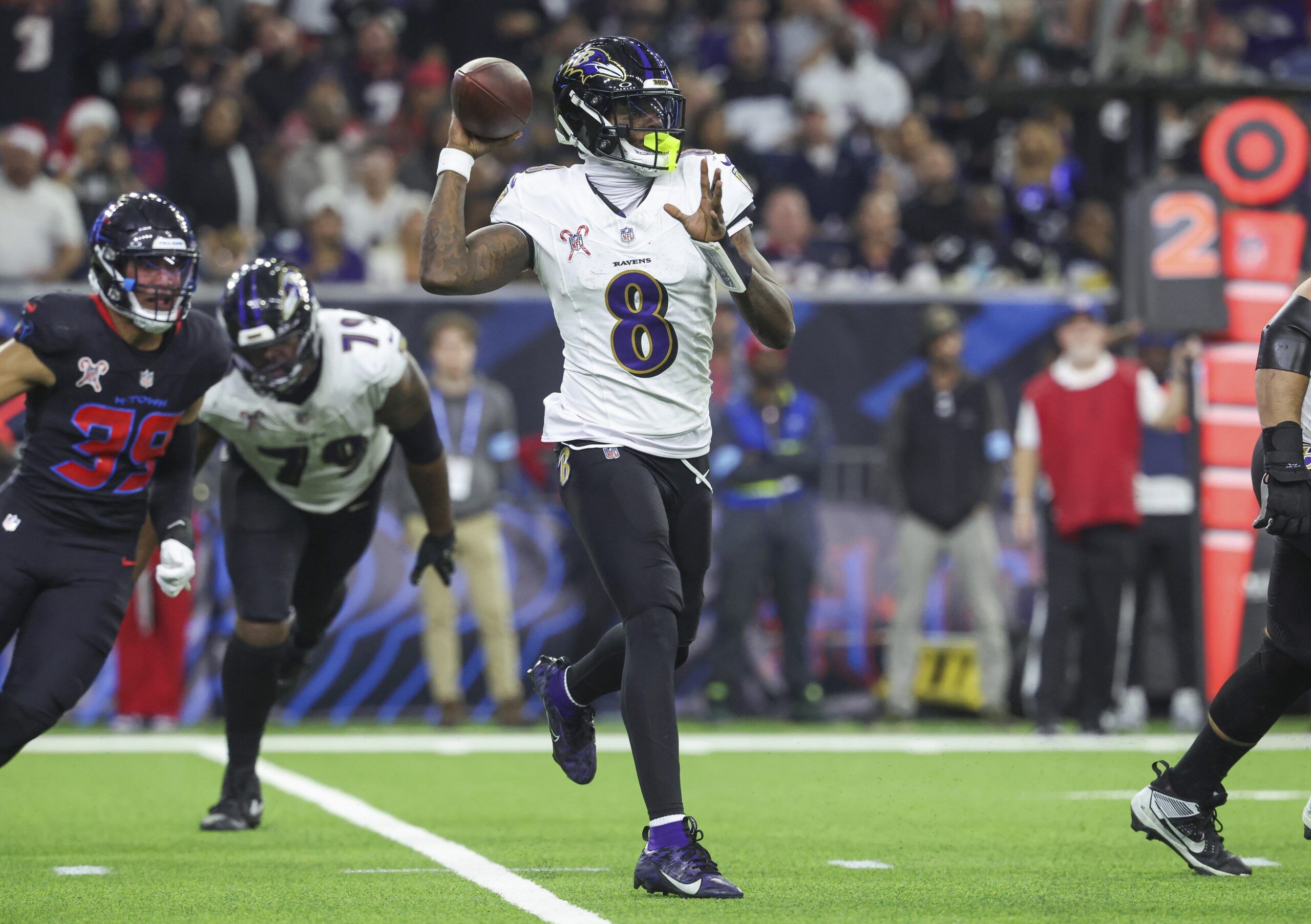 Baltimore Ravens quarterback Lamar Jackson (8) throws the ball during the second quarter against the Houston Texans at NRG Stadium.