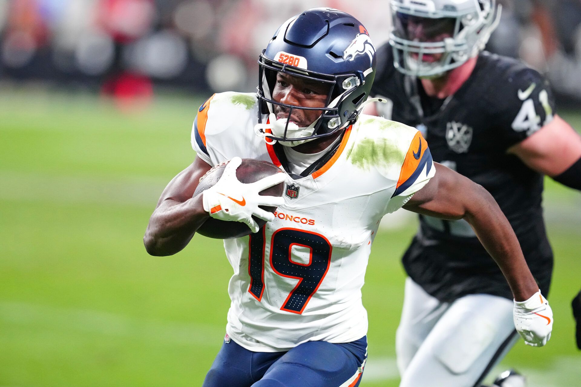 Nov 24, 2024; Paradise, Nevada, USA; Denver Broncos wide receiver Marvin Mims Jr. (19) gains yardage against the Las Vegas Raiders during the fourth quarter at Allegiant Stadium. Mandatory Credit: Stephen R. Sylvanie-Imagn Images