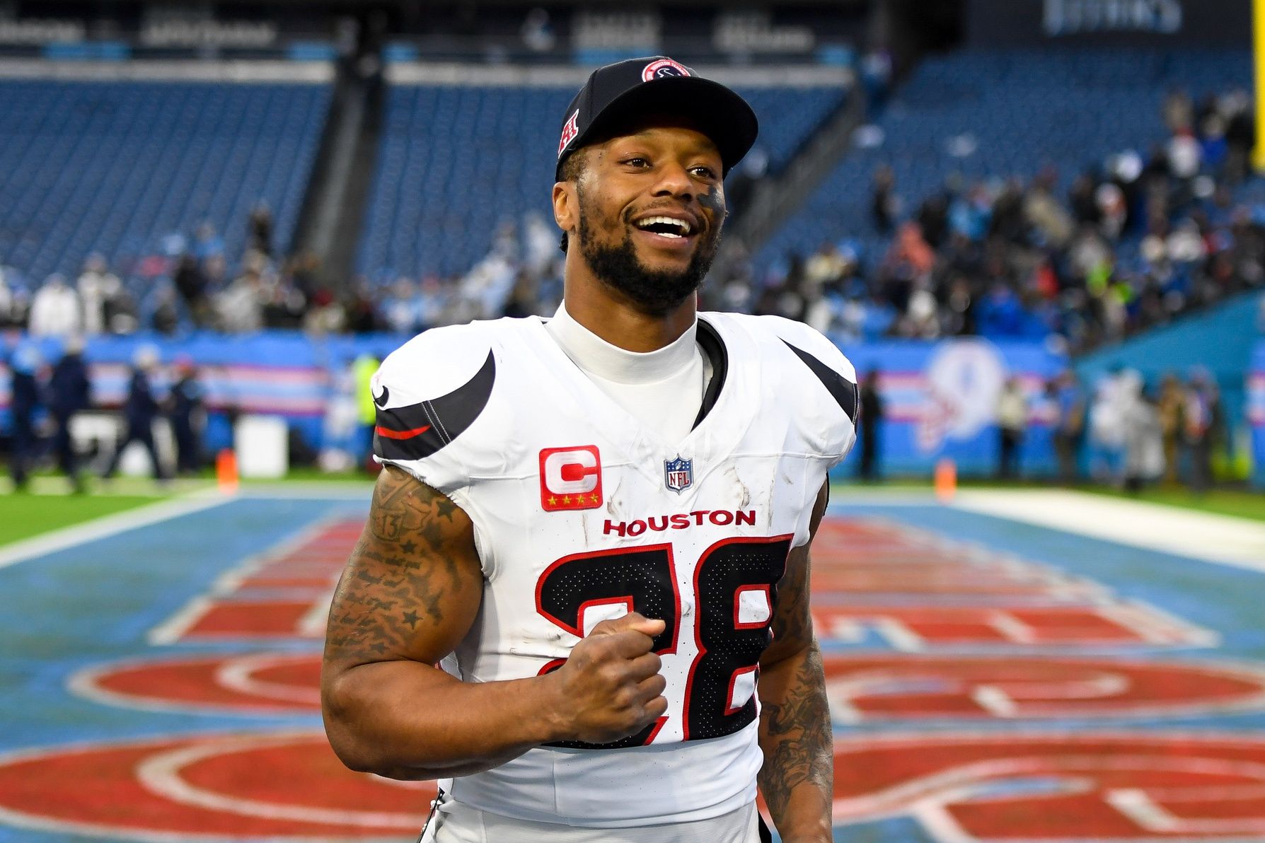 Houston Texans running back Joe Mixon (28) smiles as he leaves the field against the Tennessee Titans during the second half at Nissan Stadium.