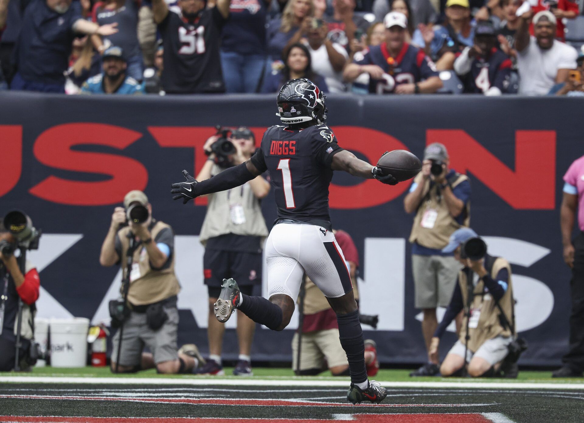 Houston Texans wide receiver Stefon Diggs (1) scores a touchdown during the first quarter against the Jacksonville Jaguars at NRG Stadium.