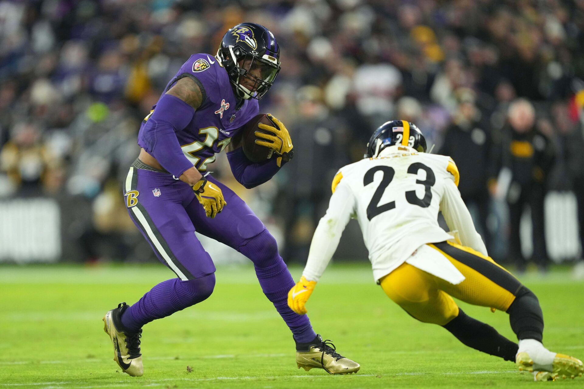 Baltimore Ravens running back Derrick Henry (22) is defended by Pittsburgh Steelers safety Damontae Kazee (23) in the first quarter at M&T Bank Stadium