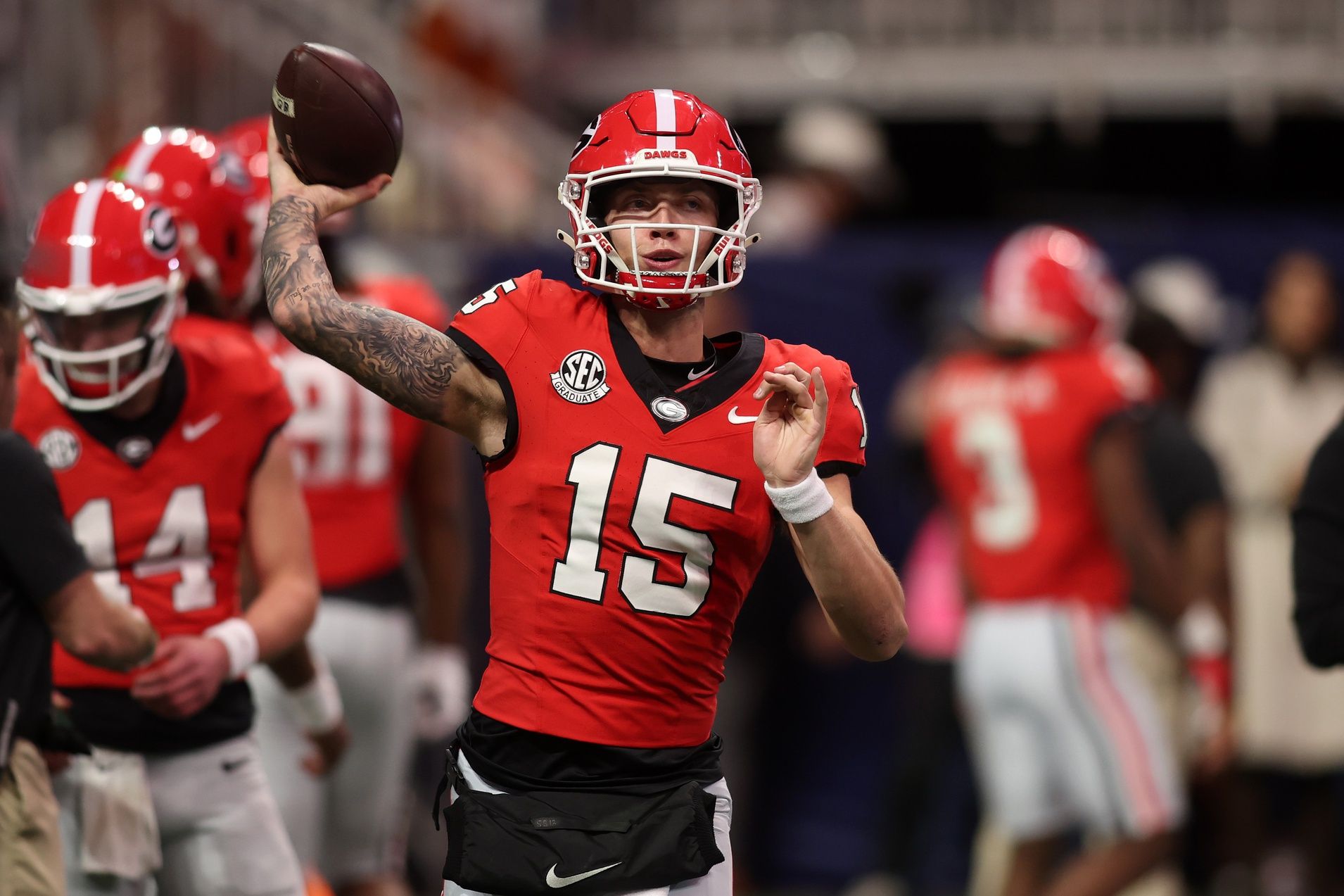 Georgia Bulldogs quarterback Carson Beck (15) practices before the 2024 SEC Championship game at Mercedes-Benz Stadium.