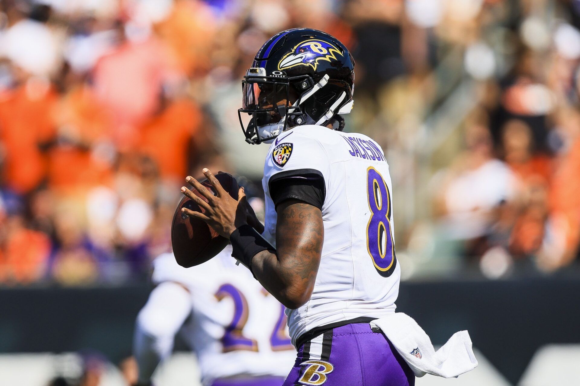 Baltimore Ravens quarterback Lamar Jackson (8) holds the ball against the Cincinnati Bengals in the first half at Paycor Stadium.