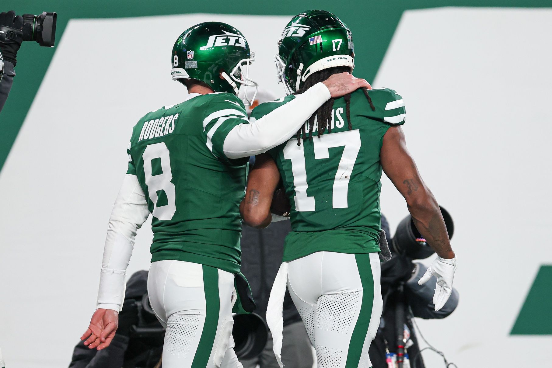 New York Jets quarterback Aaron Rodgers (8) and wide receiver Davante Adams (17) celebrate after a touchdown during the second half against the Miami Dolphins at MetLife Stadium.