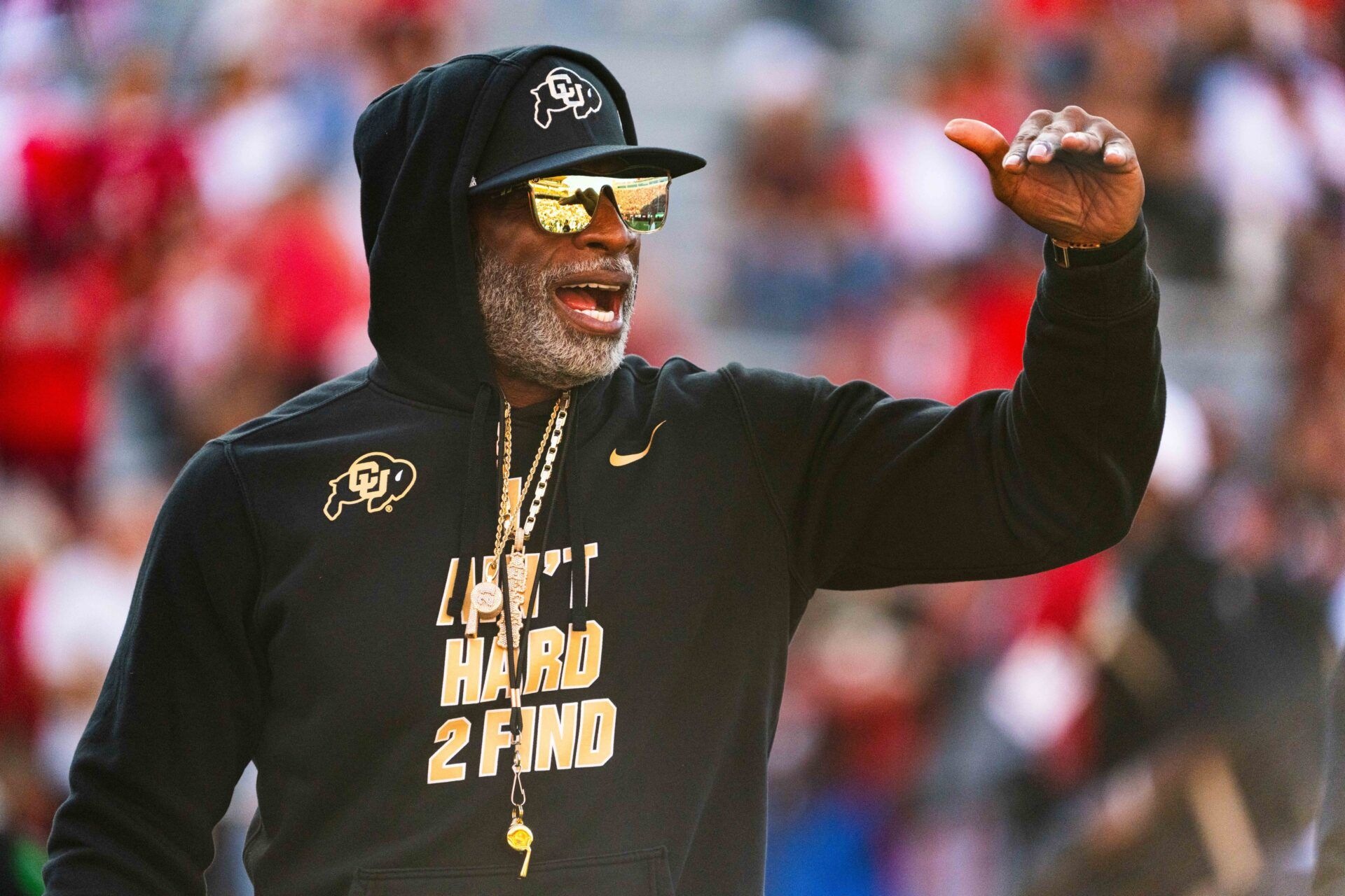 Colorado Buffaloes head coach Deion Sanders watches warmups before the game against the Nebraska Cornhuskers at Memorial Stadium.