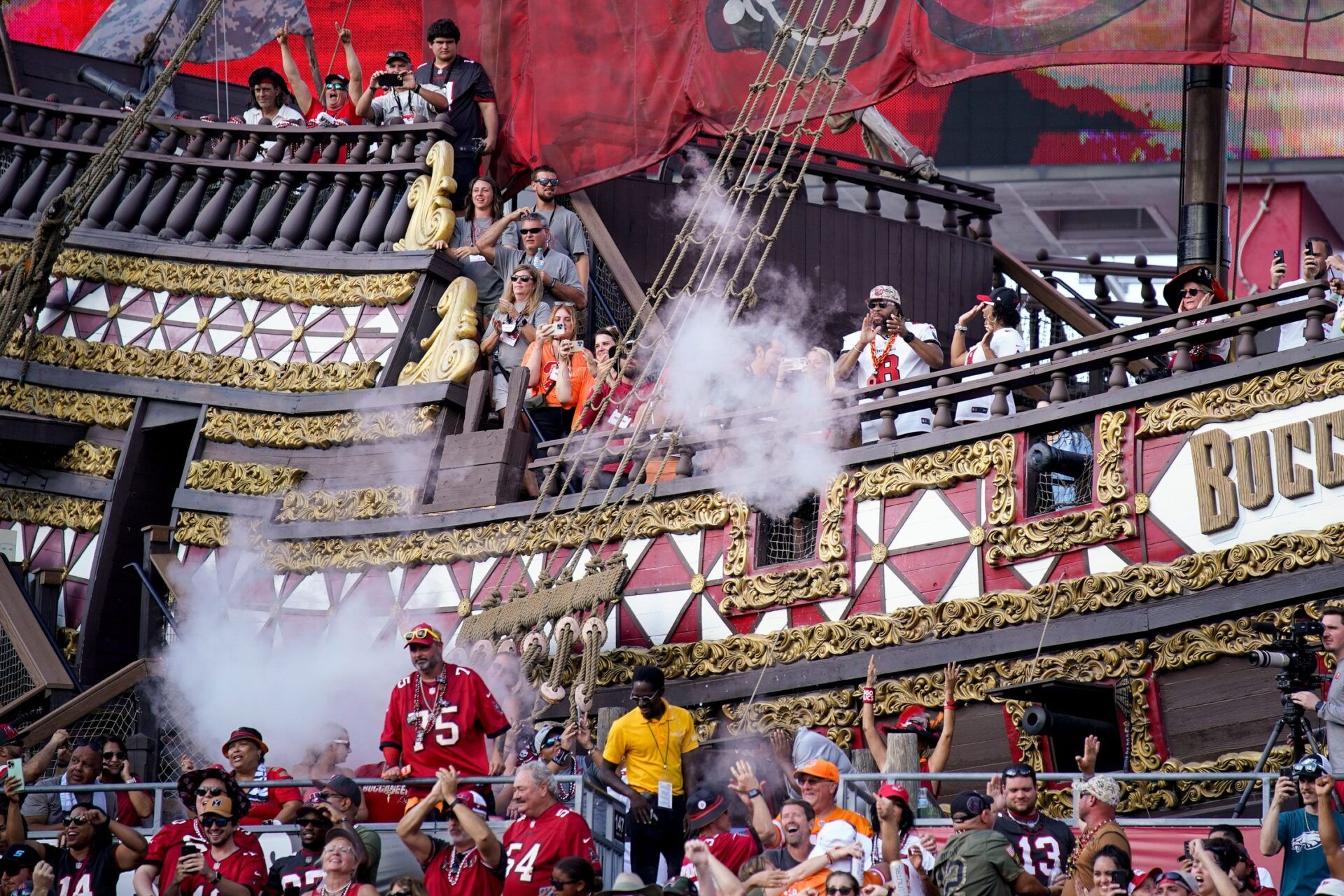 Tampa Bay Buccaneers fans celebrate after wide receiver Mike Evans made a touchdown against the Tennessee Titans during the third quarter at Raymond James Stadium in Tampa, Fla., Sunday, Nov. 12, 2023.