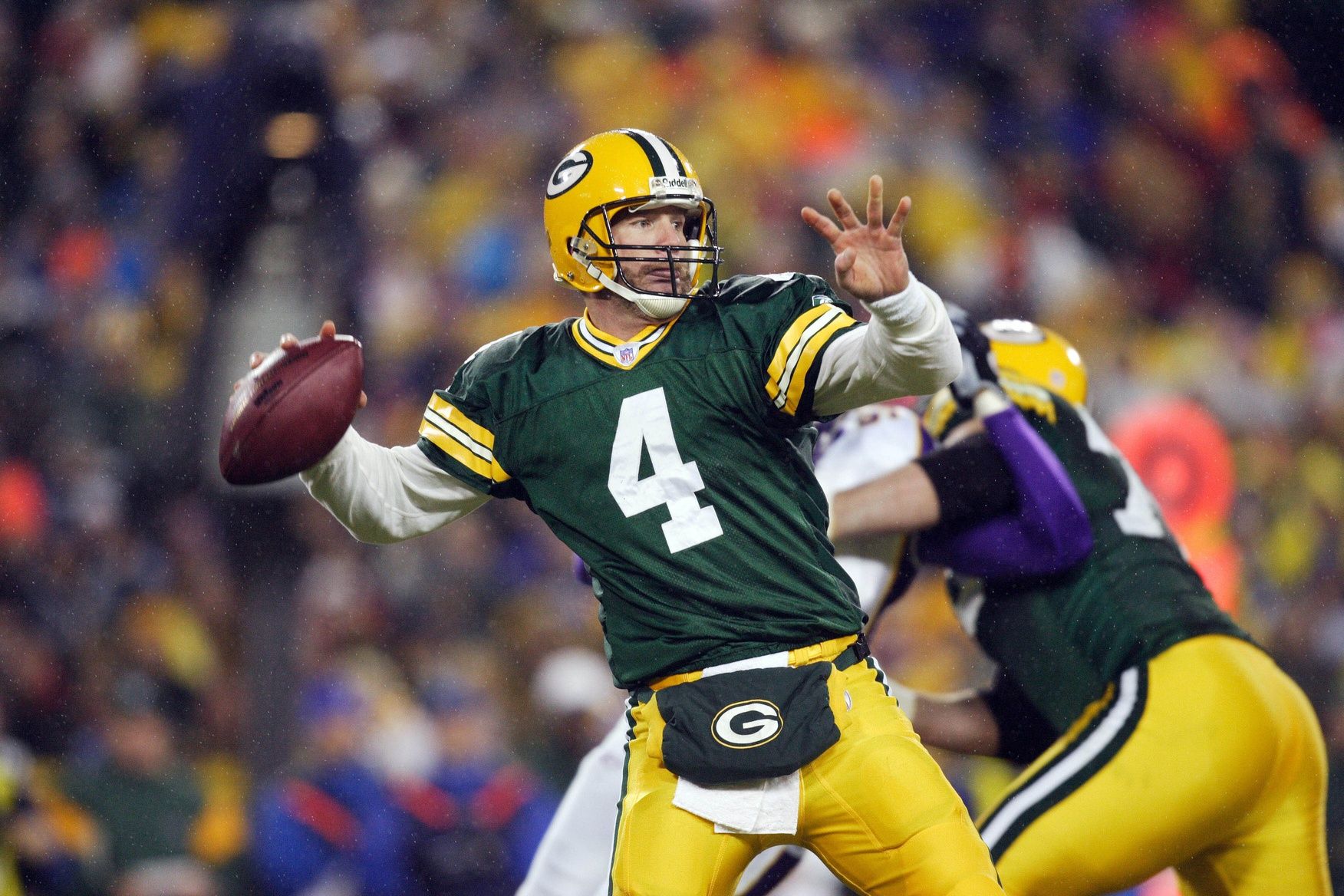 Green Bay Packers quarterback (4) Brett Favre throws a pass during the first quarter against the Minnesota Vikings at Lambeau Field.