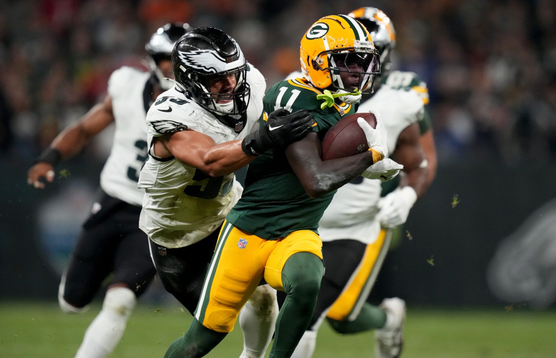 Sep 6, 2024; Sao Paulo, BRA; Green Bay Packers wide receiver Jayden Reed (11) runs against Philadelphia Eagles linebacker Zack Baun (53) during the first half at Neo Quimica Arena. Mandatory Credit: Kirby Lee-Imagn Images