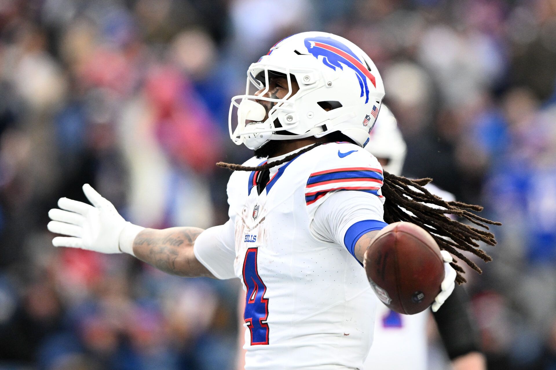 Jan 5, 2025; Foxborough, Massachusetts, USA; Buffalo Bills running back James Cook (4) reacts after scoring a touchdown against the New England Patriots during the second half at Gillette Stadium. Mandatory Credit: Brian Fluharty-Imagn Images