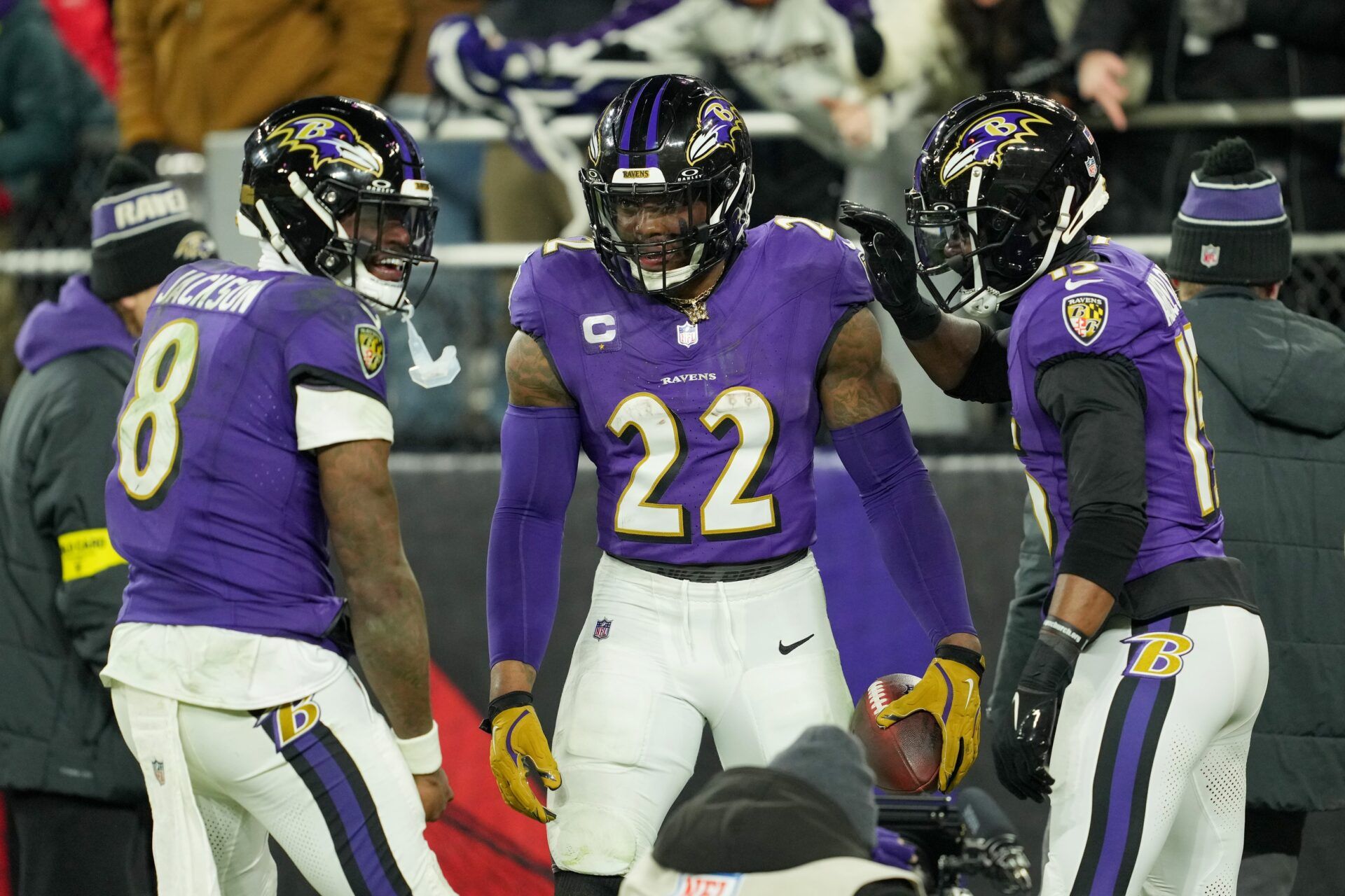 Baltimore Ravens running back Derrick Henry (22) celebrates with wide receiver Nelson Agholor (15) and quarterback Lamar Jackson (8) after scoring a touchdown against the Pittsburgh Steelers in the third quarter in an AFC wild card game at M&T Bank Stadium.